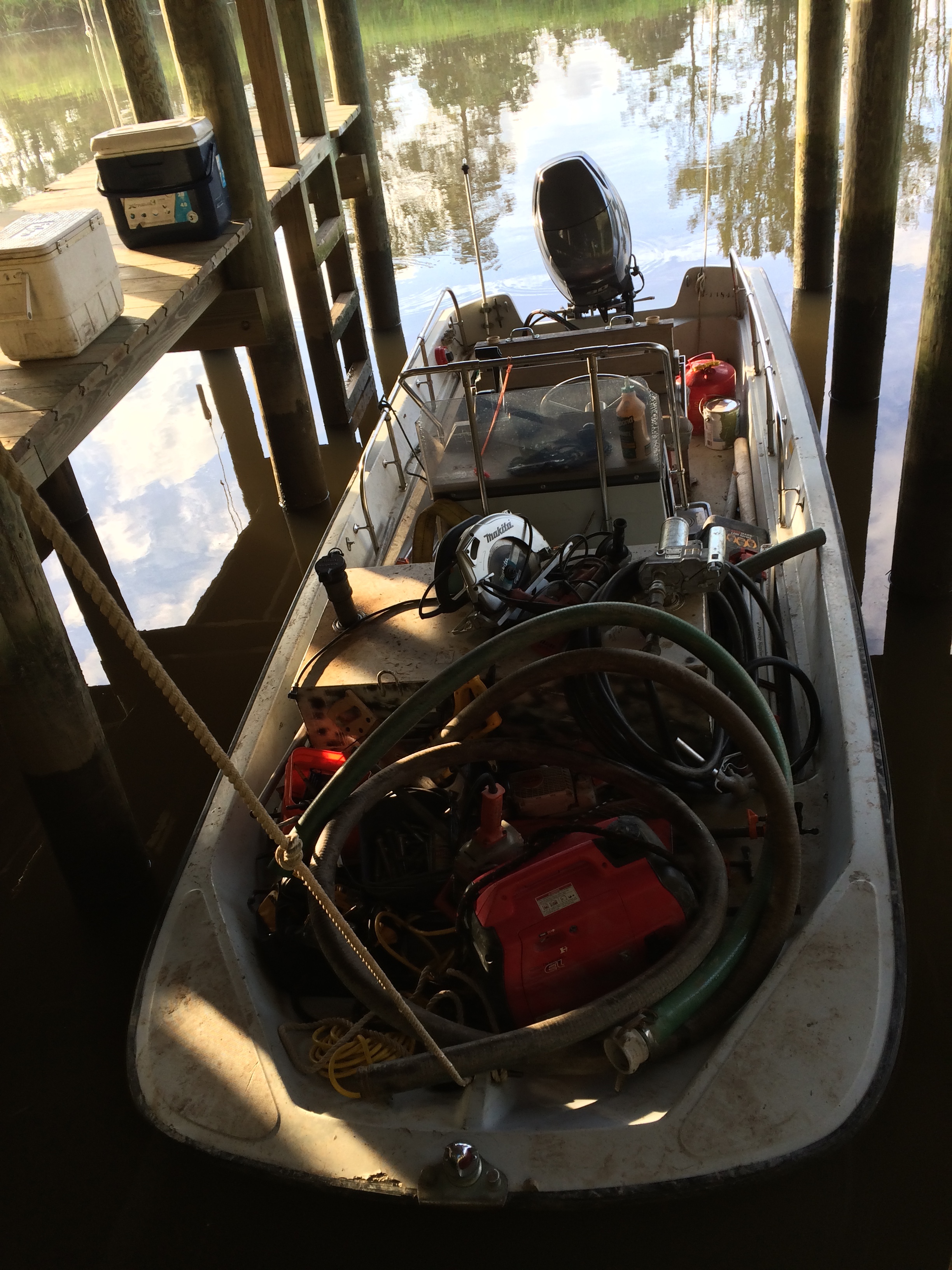 Skiff loaded with tools and ready to head out to the impoundment in the boathouse at Samworth