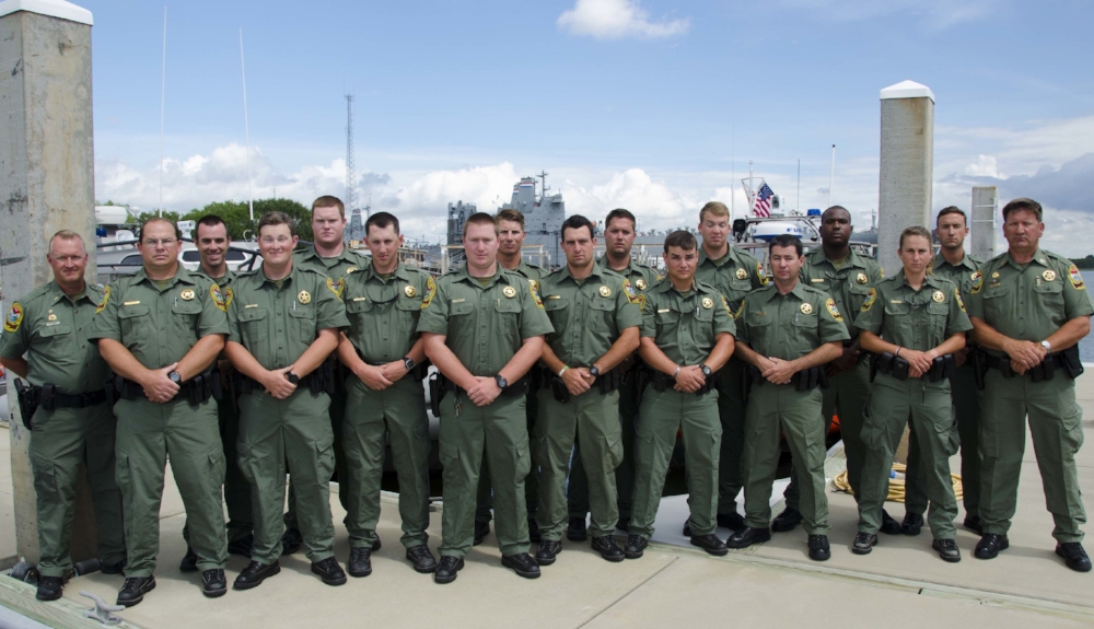 Left to right: Lead Training Supervisor Lt. R. Monnet; Pfc. J. Dozier; Pfc. J. Scogin; Pfc. J. Hammond; Pfc. B. Woodward; Pfc. D. Sherbert; Pfc. J. Riley; Pfc. A Pritcher; Pfc. A. Miller; Pfc. H. Mize; Pfc. G. Caddell; Pfc. J. Hawkins; Pfc. B. Elliott; Pfc. A. D. Ruff; Pfc. T.M. Donahue; Pfc. W. Lynch; Training Supervisor H. McClellan.
