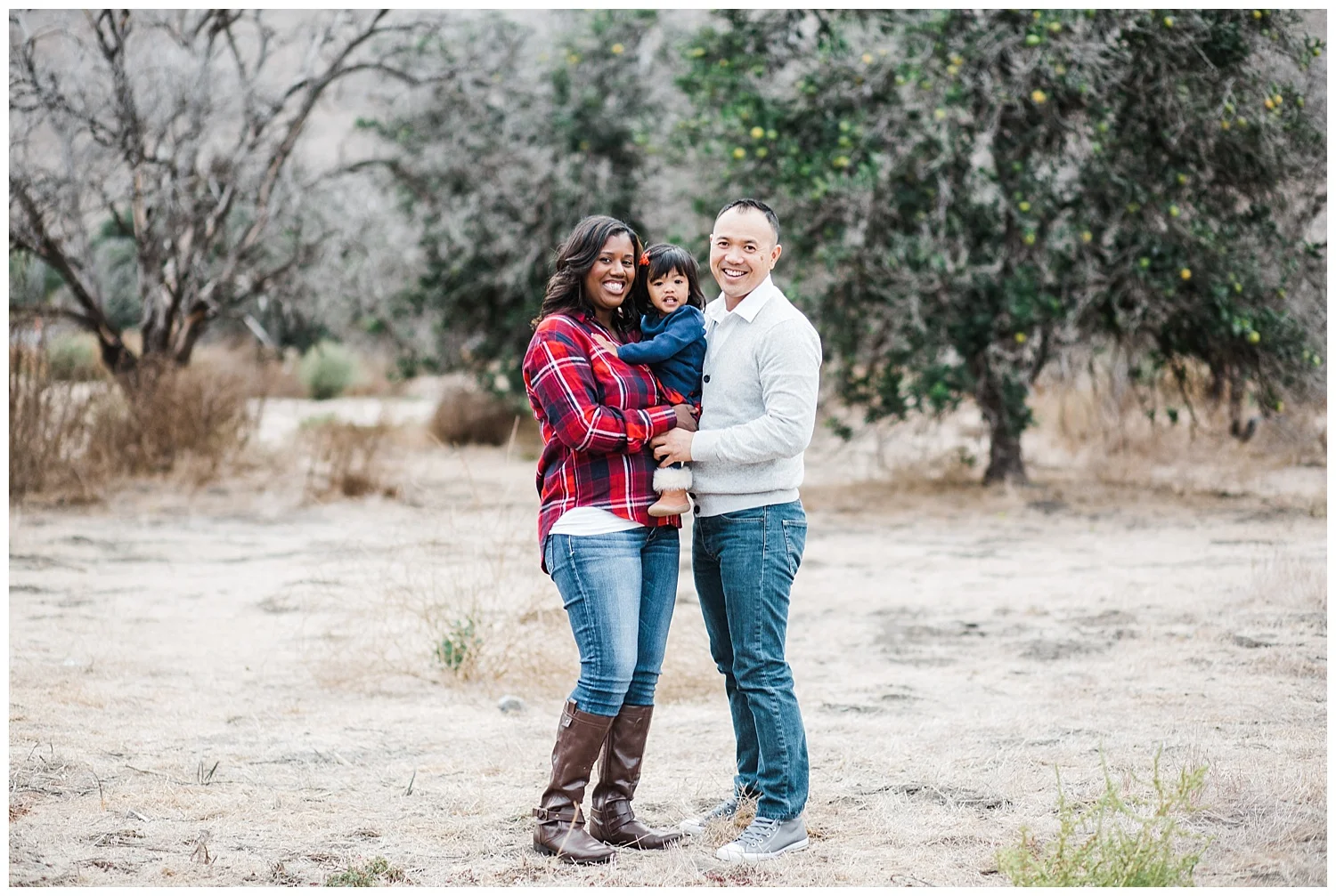 Kari Webb Photography San Juan Capistrano family standing in field with trees.jpg