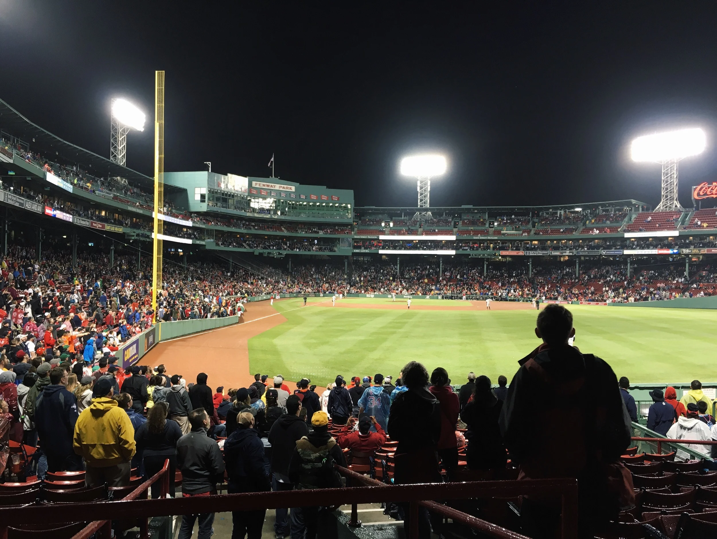 The final pitch of the game went to Big Papi, and everyone crowded around the field.