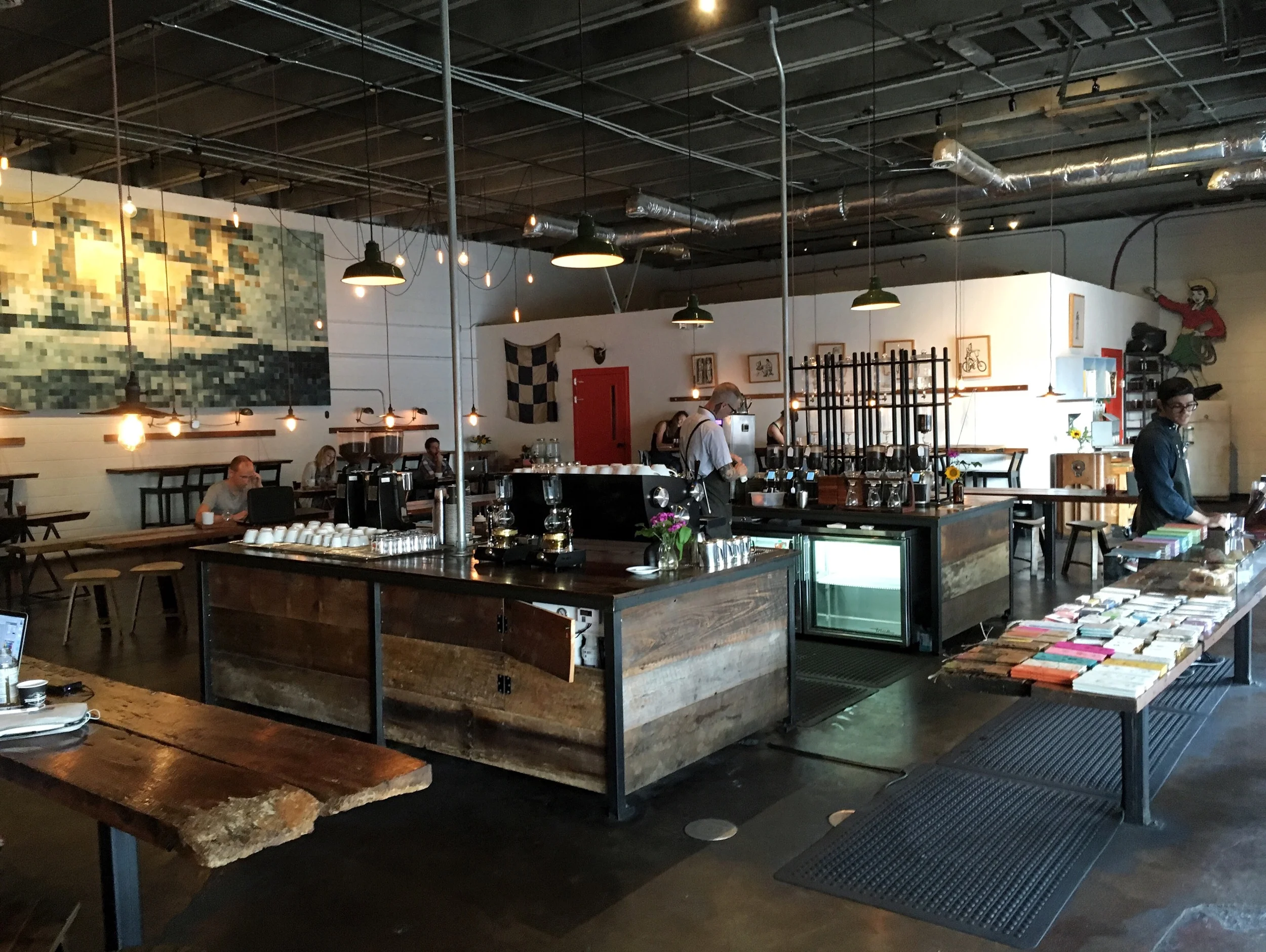 In our search for parking, we stumbled upon maybe the most aggressively trendy coffee shop in the world. The baristas looked like they'd just come out the back from fixing vintage motorbikes. I got a 1,000 layer orange peel donut and Lia got an inco…