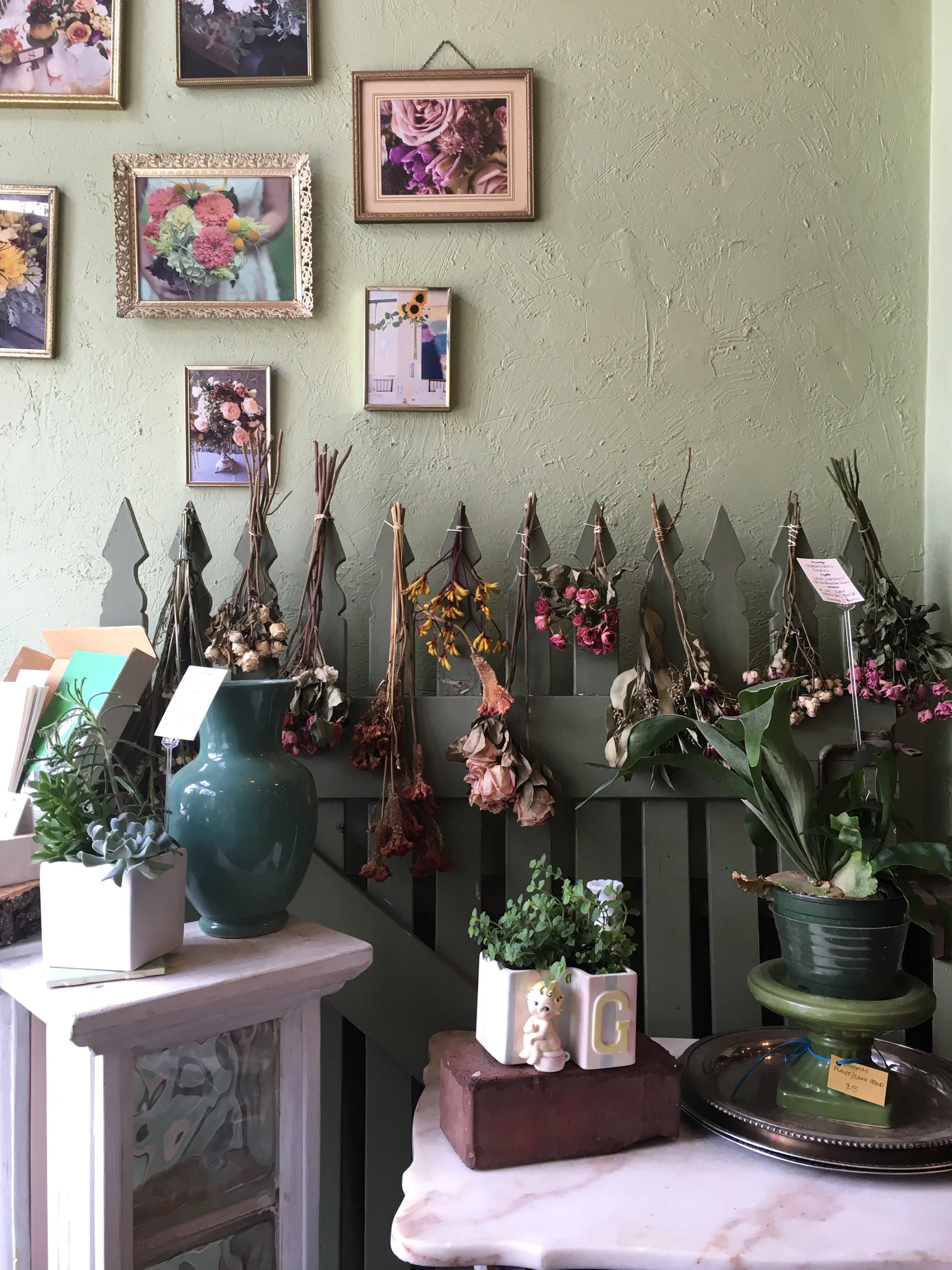 There was also a sweet pair of flower shops, which had they not been certain to die in either the remaining week and a half in the car, or the flight back to Boston, we may have picked some up!