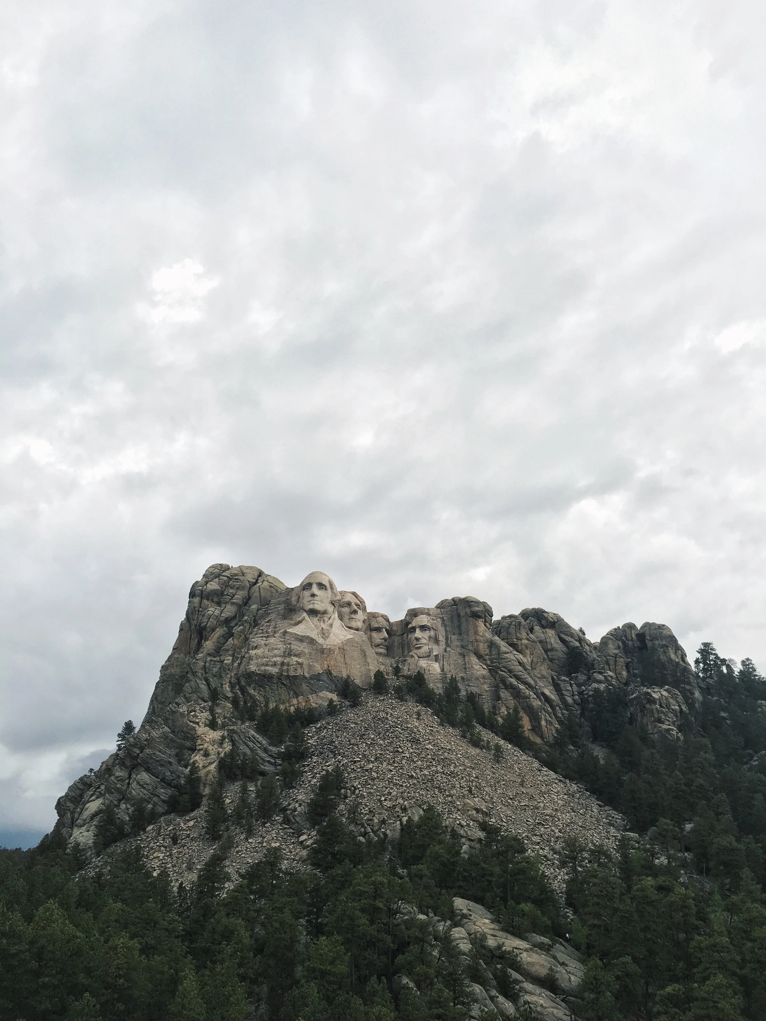 It started raining lightly, but the grey skies worked to our advantage as the literal cliff faces and dark green foliage really popped against the colour. 