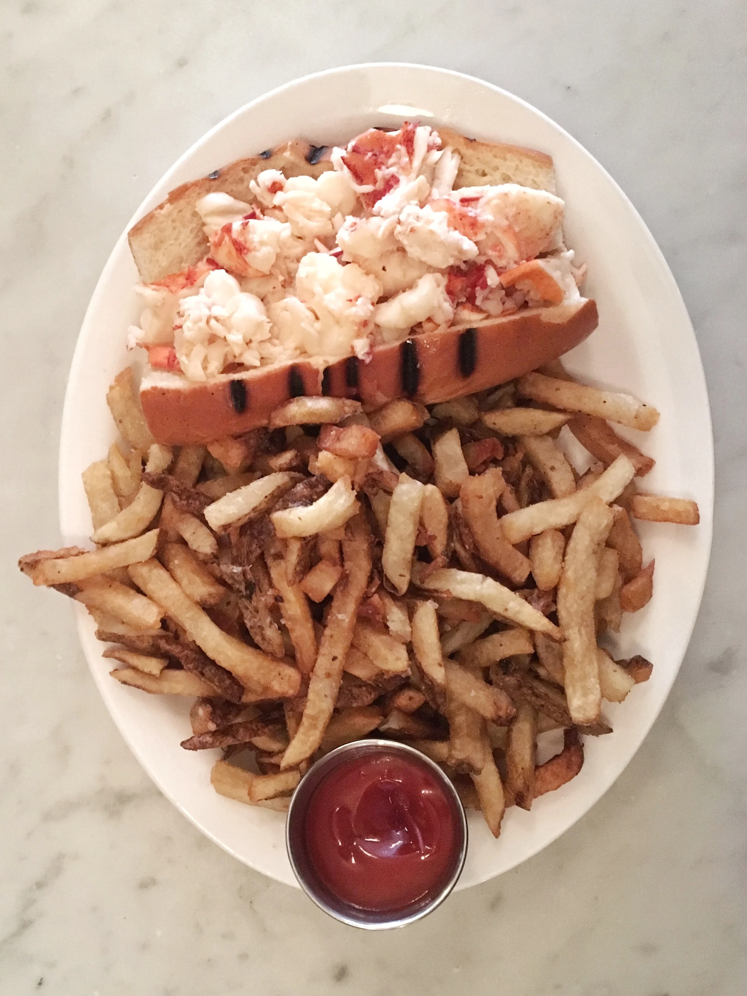 Hot lobster roll with butter and enough fries to feed the whole North End. It lived up to the hype, but we need to go back to try it cold with mayo, for science's sake.