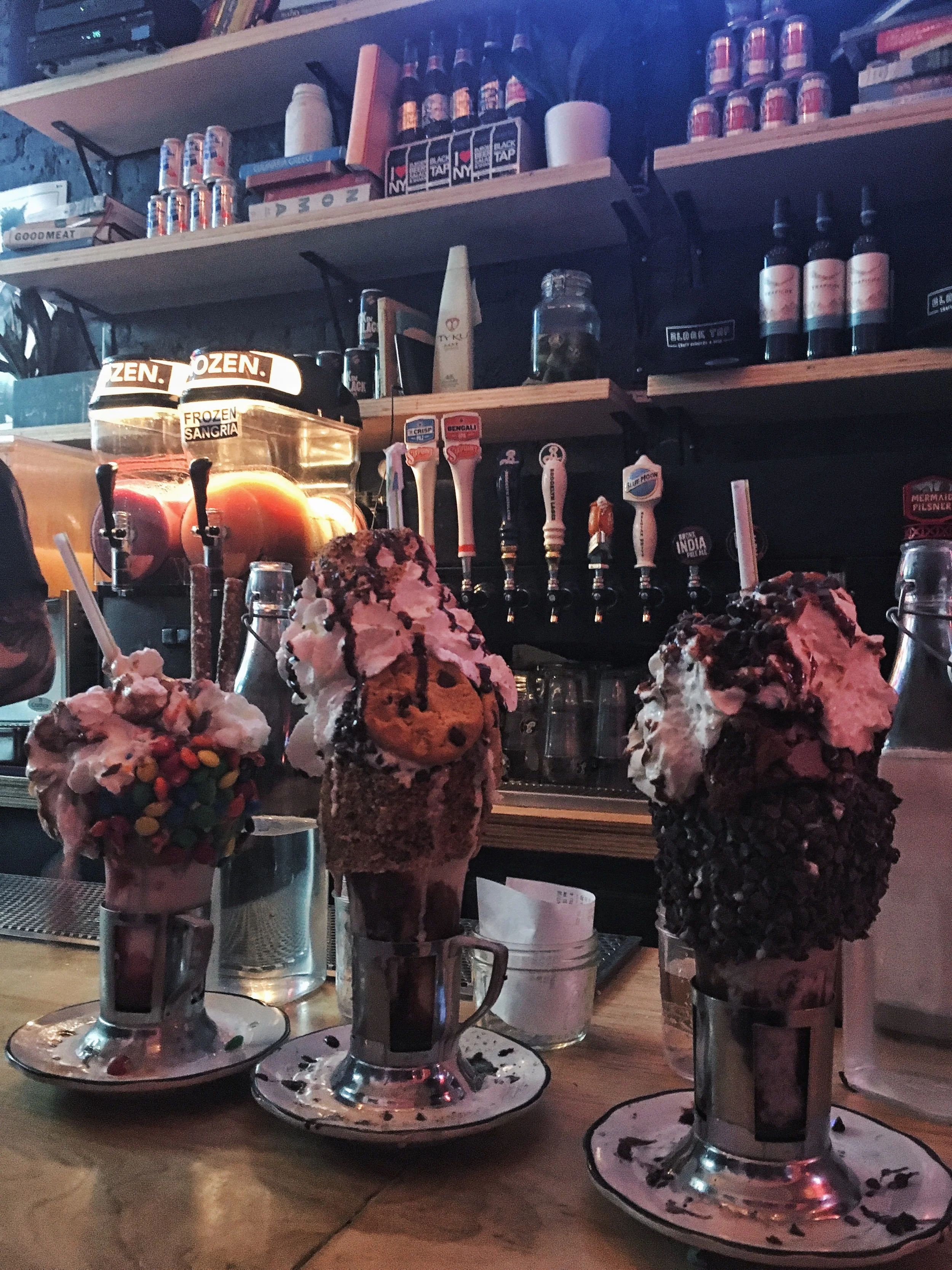 In case you missed them, there are two brownies under the whipped cream on my milkshake on the far right. I consumed it all, and a burger and fries. 