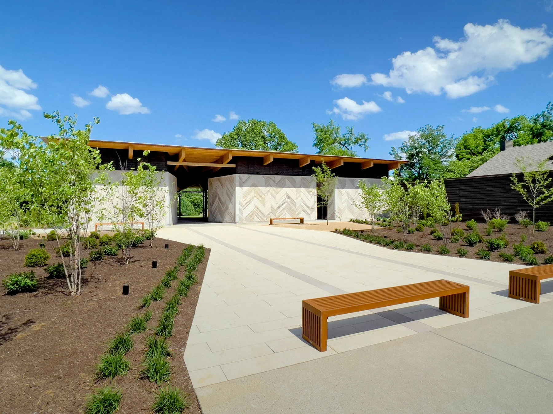 locust-grove-pavilion-exterior-approach-limestone-facade-herringbone-glulam-wood-structure-louisville-dpaw.jpg