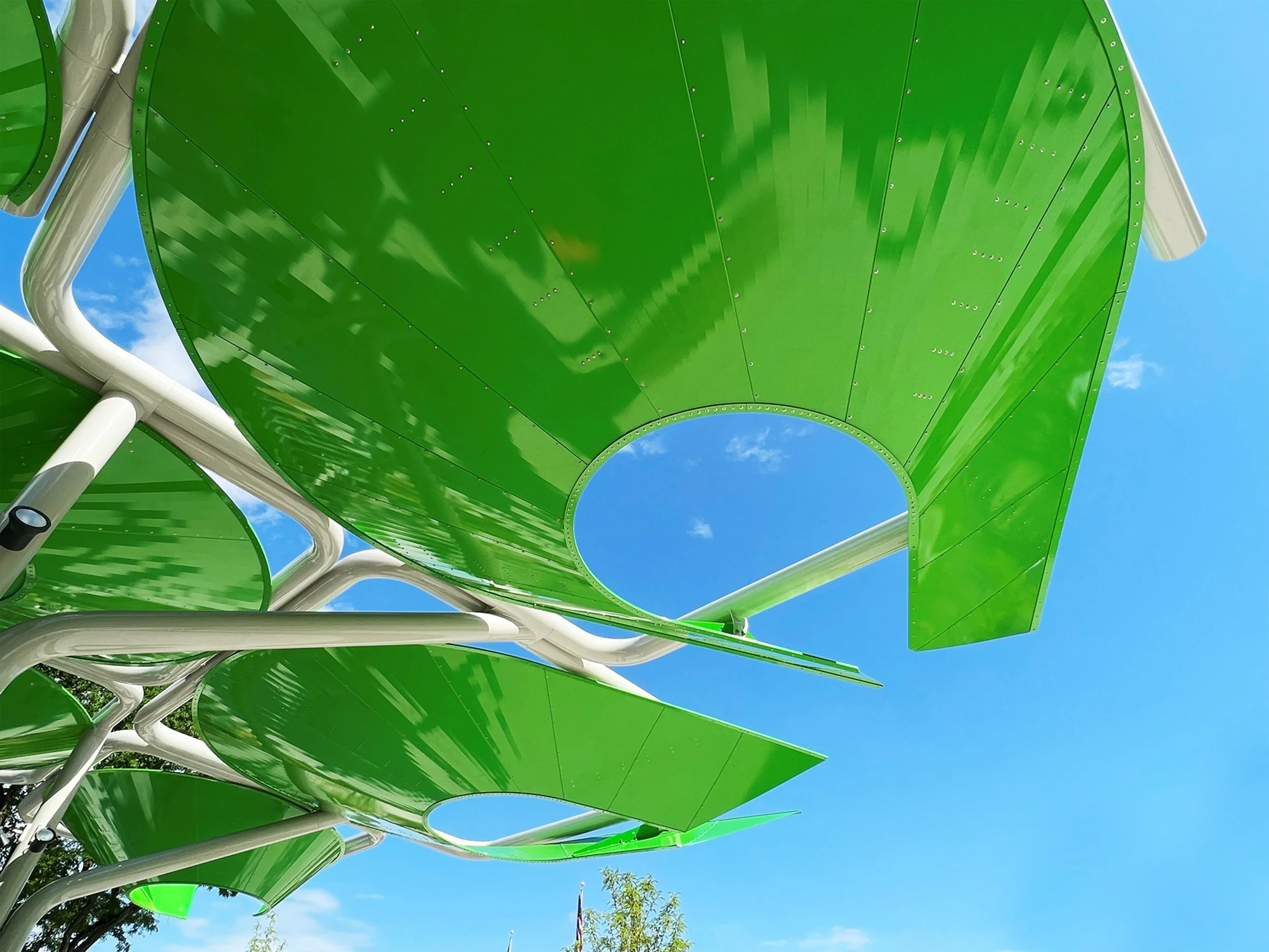 centennial-commons-pavilion-exterior-detail-green-curved-metal-panels-canopy-royal-oak-michigan-deleon-primmer-dpaw.jpg