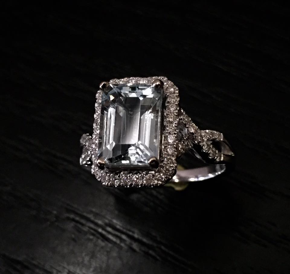 2.17 carat emerald cut Aquamarine set in a 18kt. white gold .33 carat diamond mounting..jpg