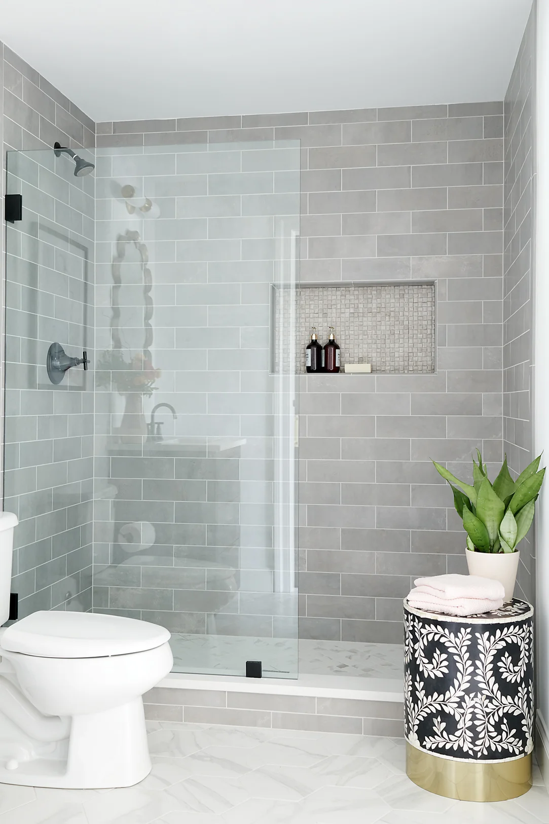 A soft tile palette gives this space a soothing feel.