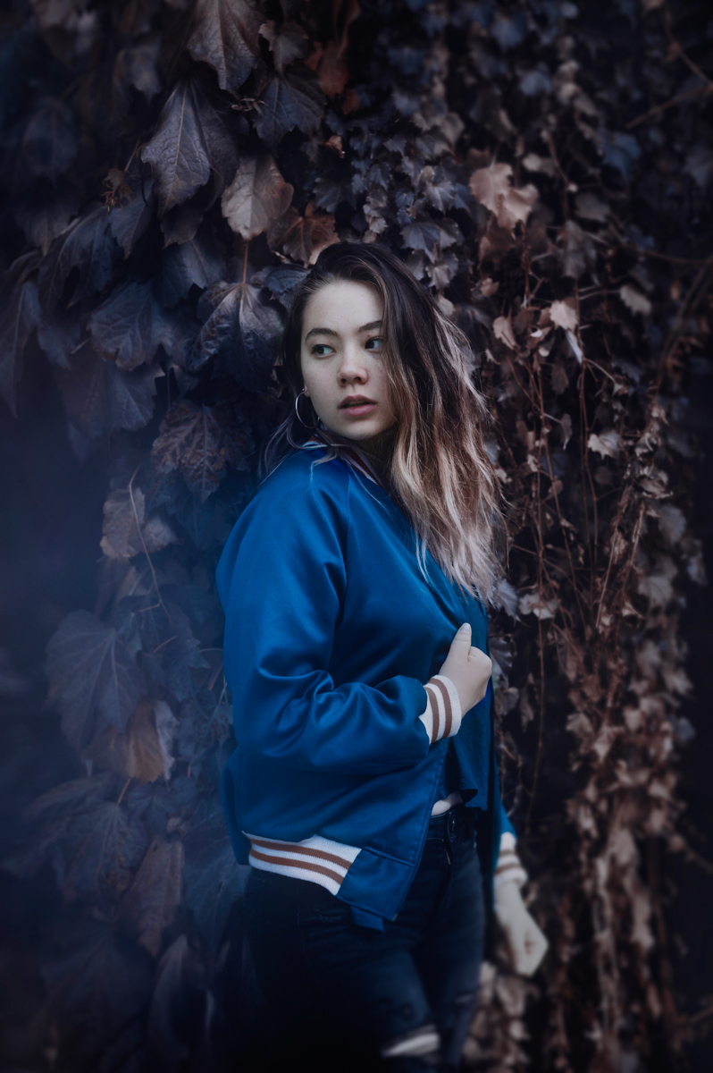Girl in Blue Bomber Jacket in Fall Outdoor Setting