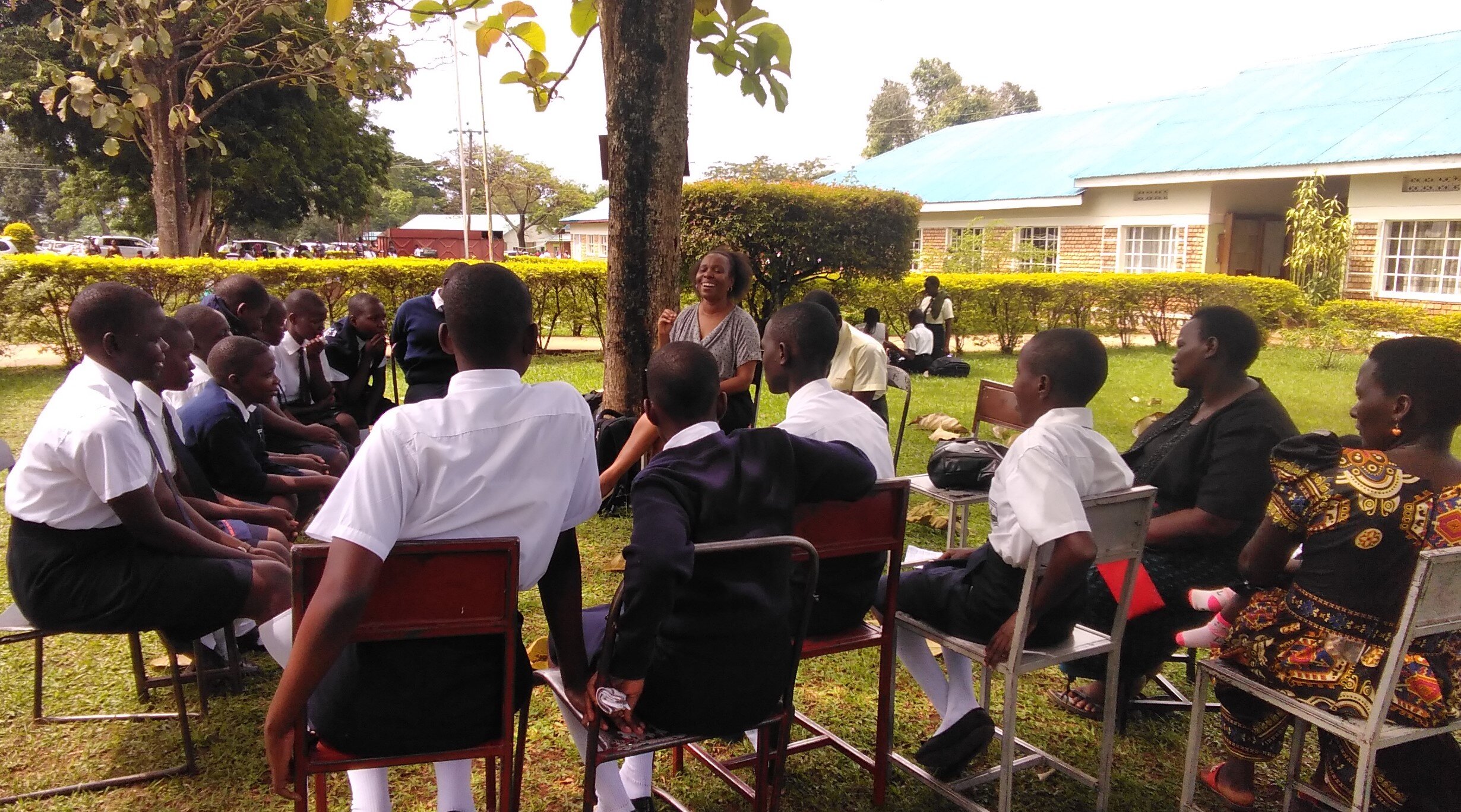  Jane Otai, Executive Director of EGI, meets with the young EGI moms at Mpoma School. 