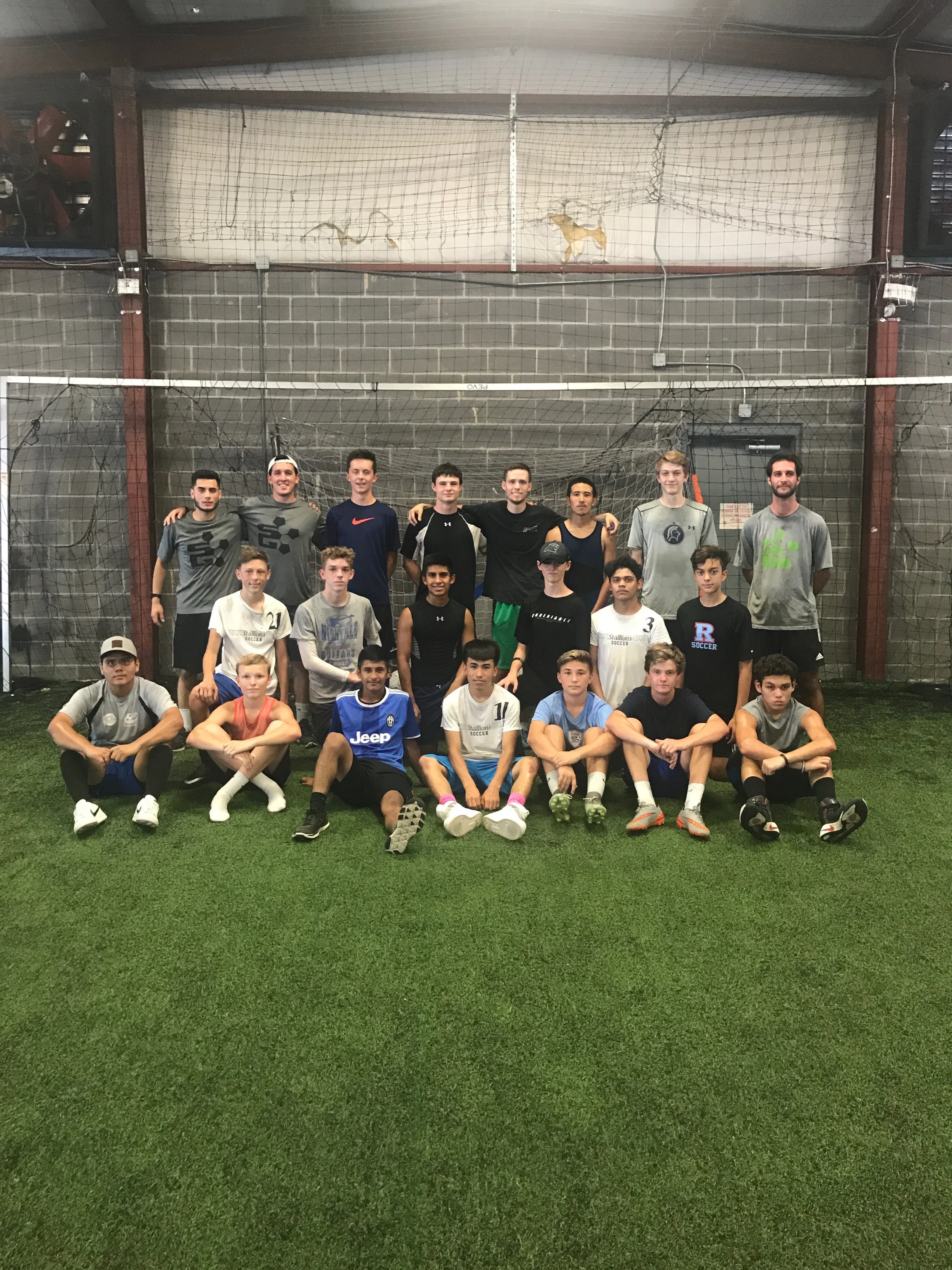Group of young men on an indoor soccer field