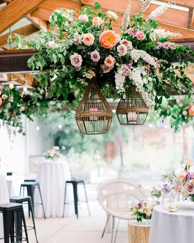 Florals designed onsite to wrap around and drip from the beams creating a lush canopy at @theitalianfoodproject | Image by @themoodlab