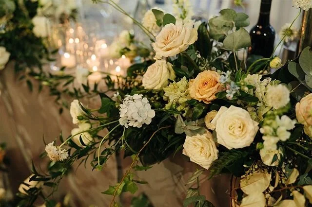Kirsty &amp; Johnny&rsquo;s bridal table was DRIPPIN&rsquo; in florals. Like literally... arrangements were cascading down the front edge to meet florals growing up from the floor. It was lush, garden-y and a whoooole vibe ✨ Image by @hellosweetheartau