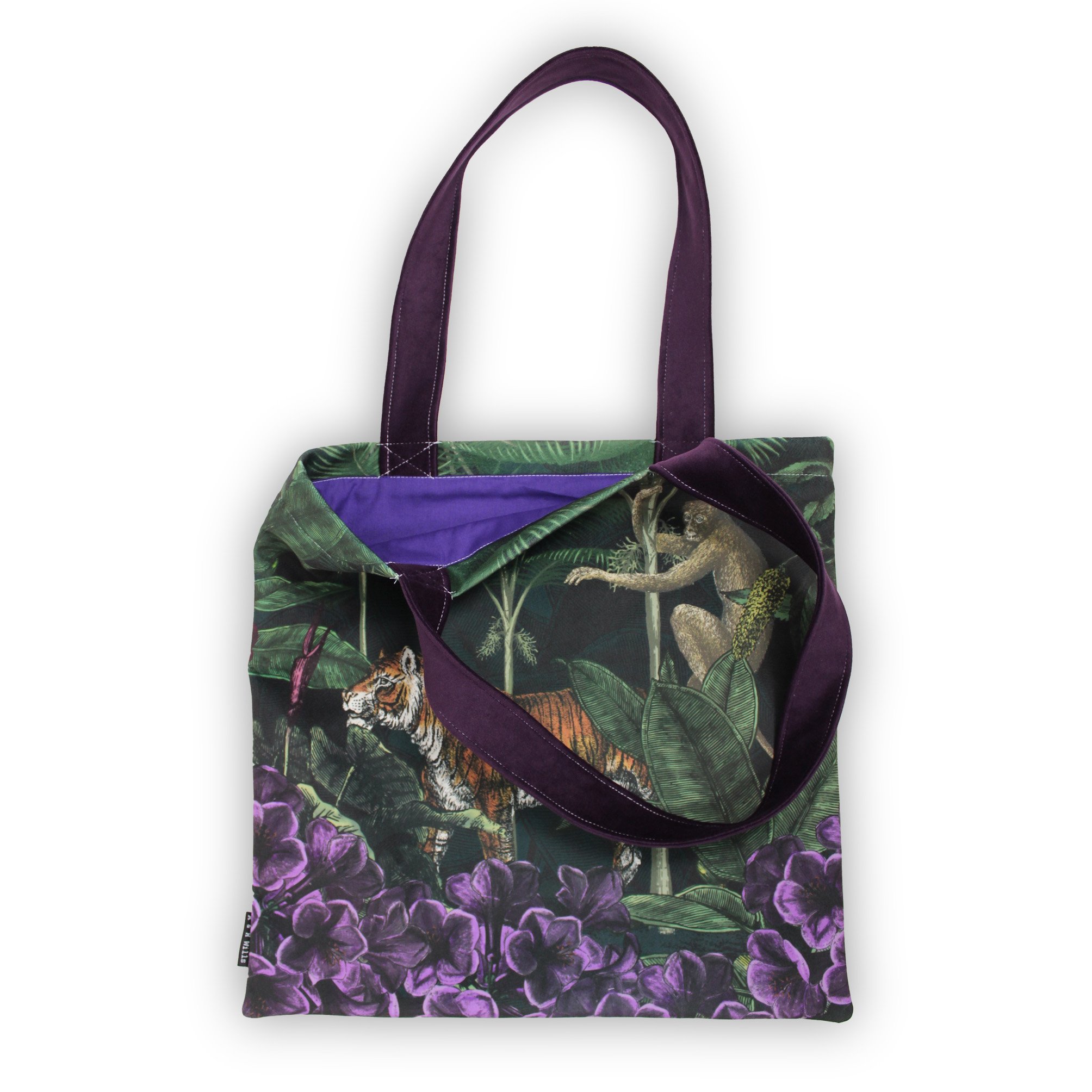 jungle tote with purple lining detail.jpg