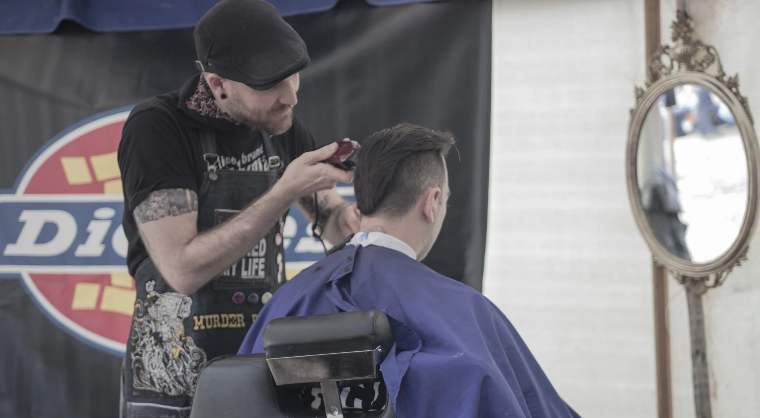 PJ fixing up Chris, Bassist of Anti-Flag before their epic set!