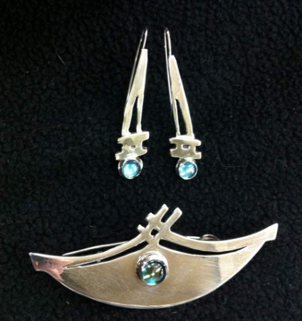 Silver with rainbow topaz . 1″ x 3″ brooch