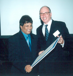 Sri Lankan investigative journalist Lasantha Wickramatunga receiving the 2000 Integrity Awards from Frank Vogl. In January 2009, Lasantha was murdered. It was widely reported as a political assassination in retribution for his years of writing about governmental corruption.