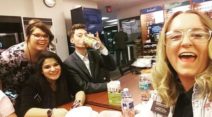 Emilie (far left) serving as a Young Church Service Missionary at the Church Office Building