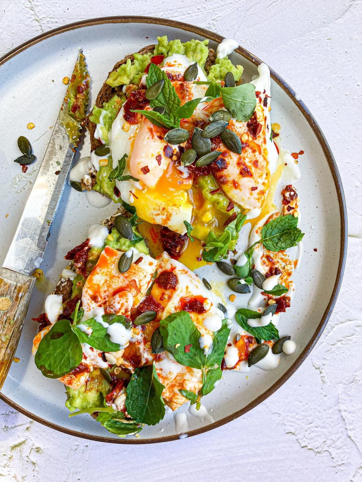AVOCADO TOAST WITH HARISSA POACHED EGGS &amp; MINT YOGURT