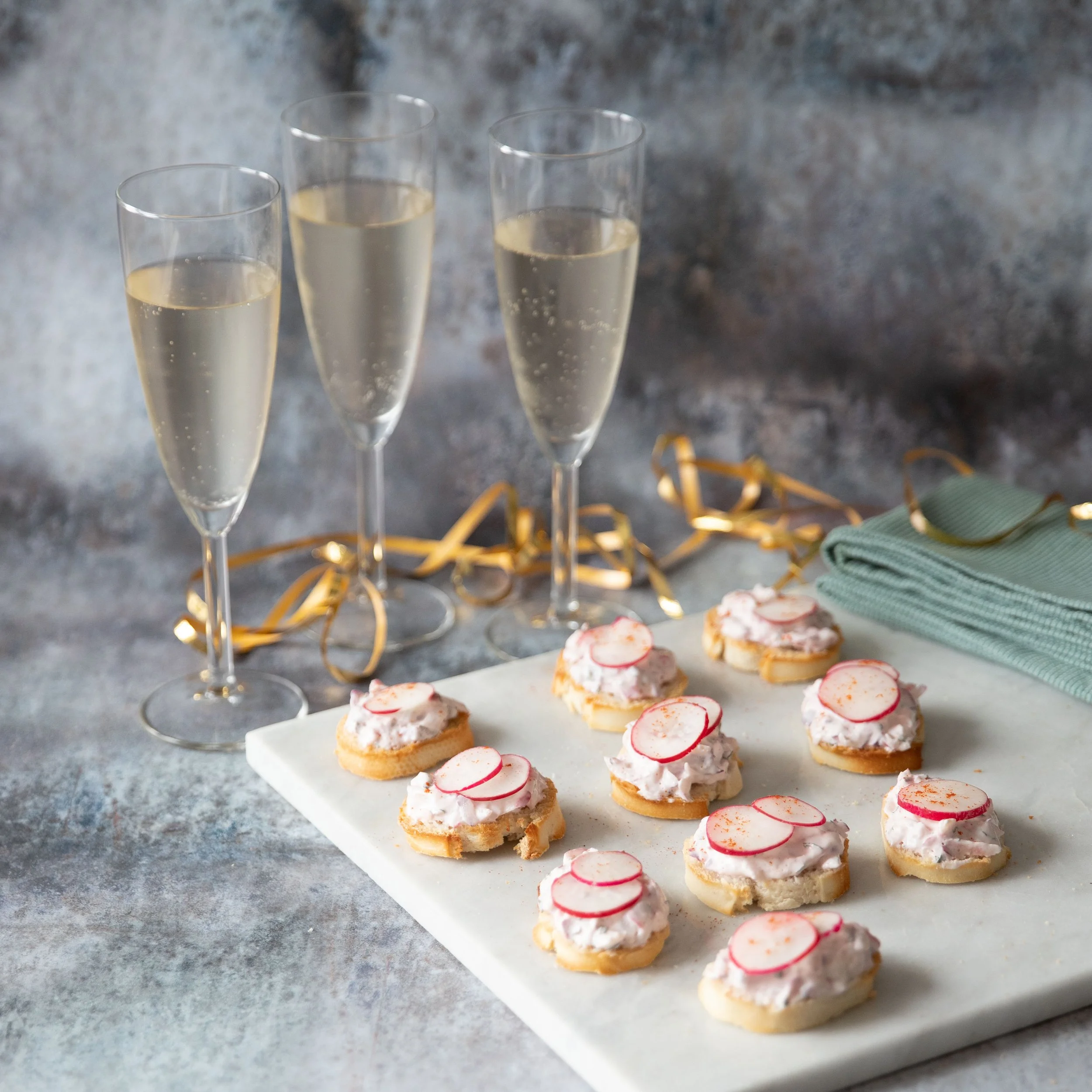 Radish and soft cheese canapés
