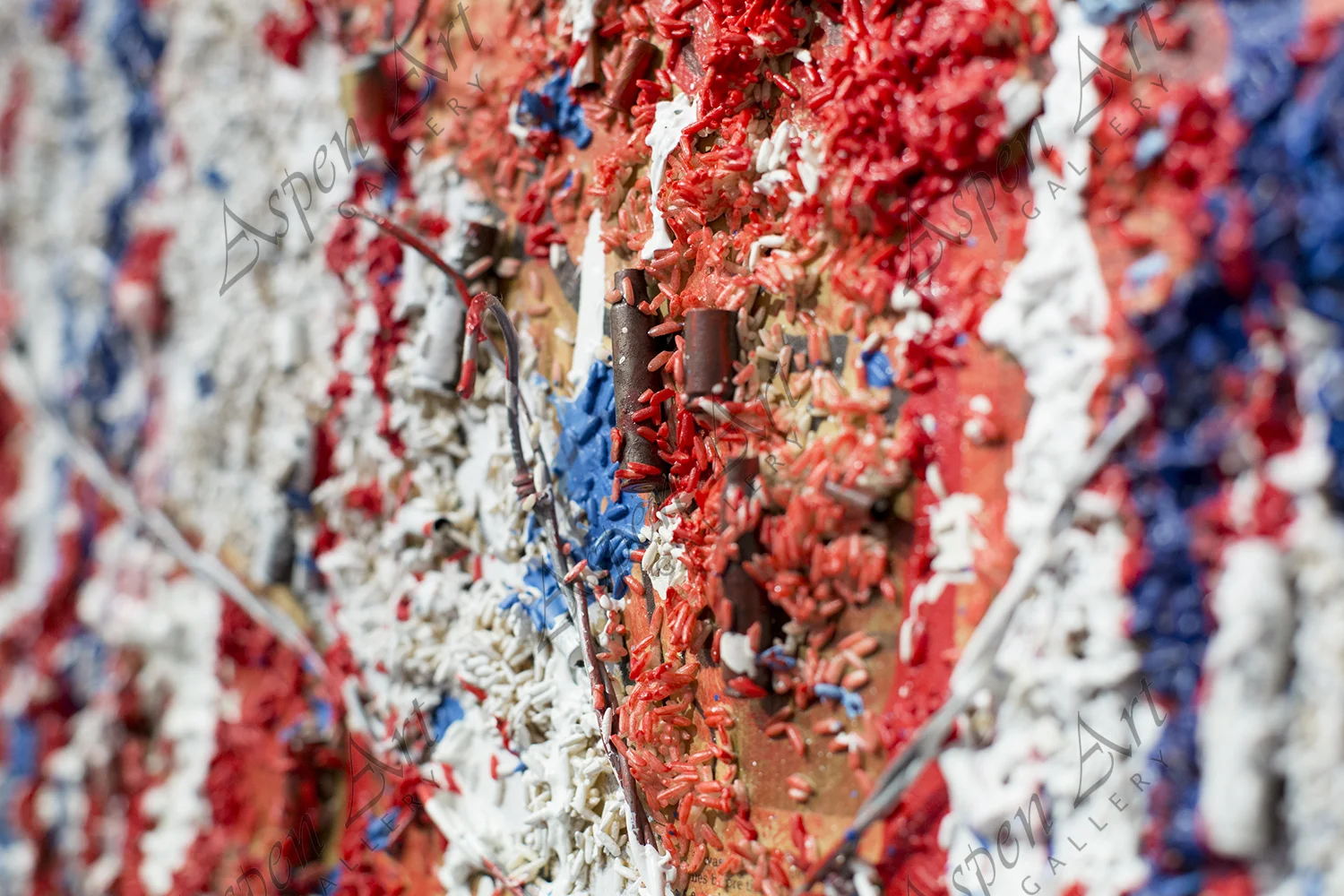 The flags are made of rice, bullets, barded wire...