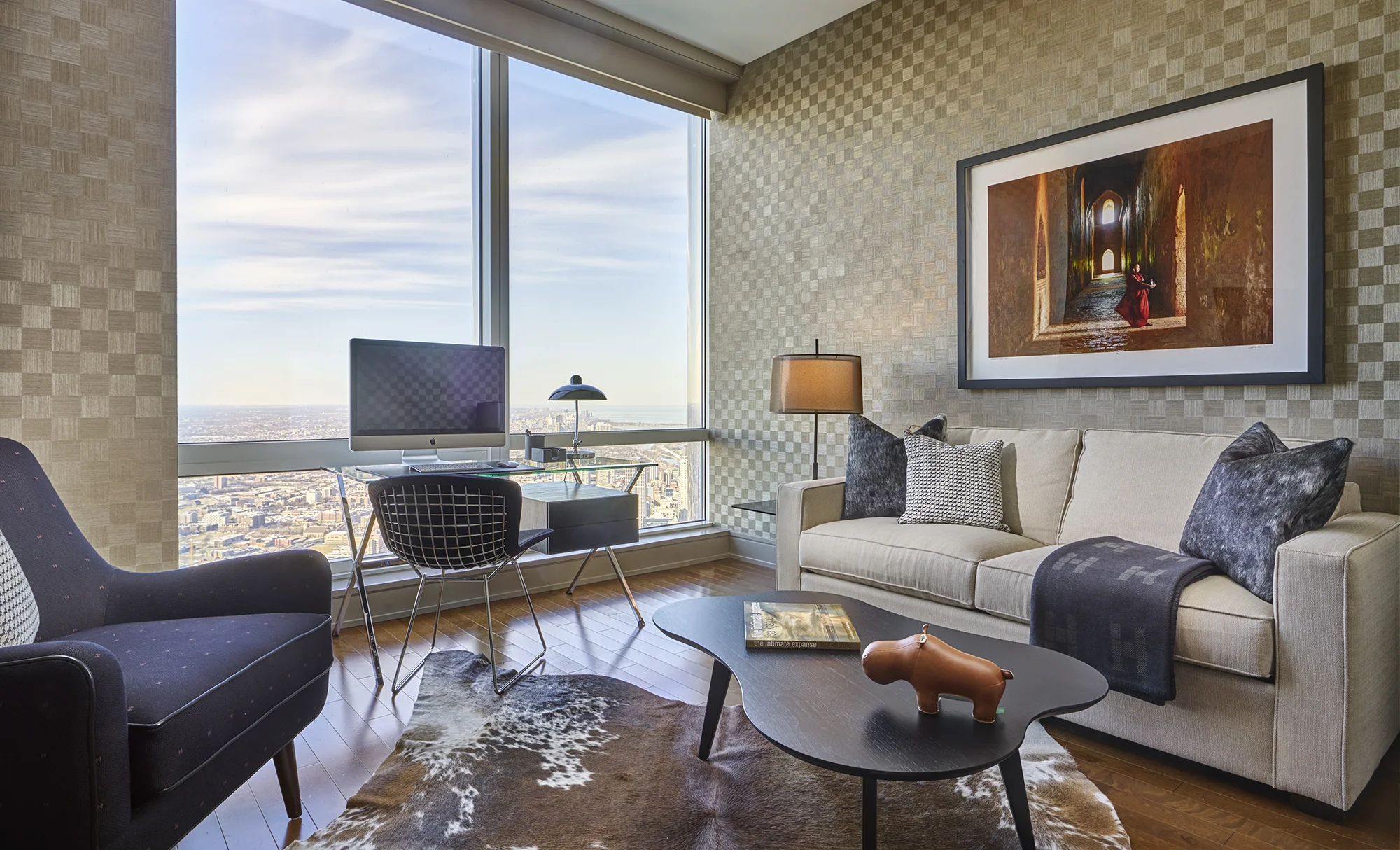 Custom Wallpaper, Knoll Furniture and Hermes Fabrics and Accessories immerse the Study at a Penthouse at 401 North Wabash