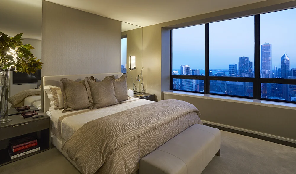 The Master Bedroom Suite upholstered in Silk Wallcovering and clad in Frette Linens in a Residence at The Watertower