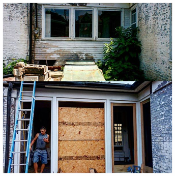 Before and in-progress of the breezeway wall