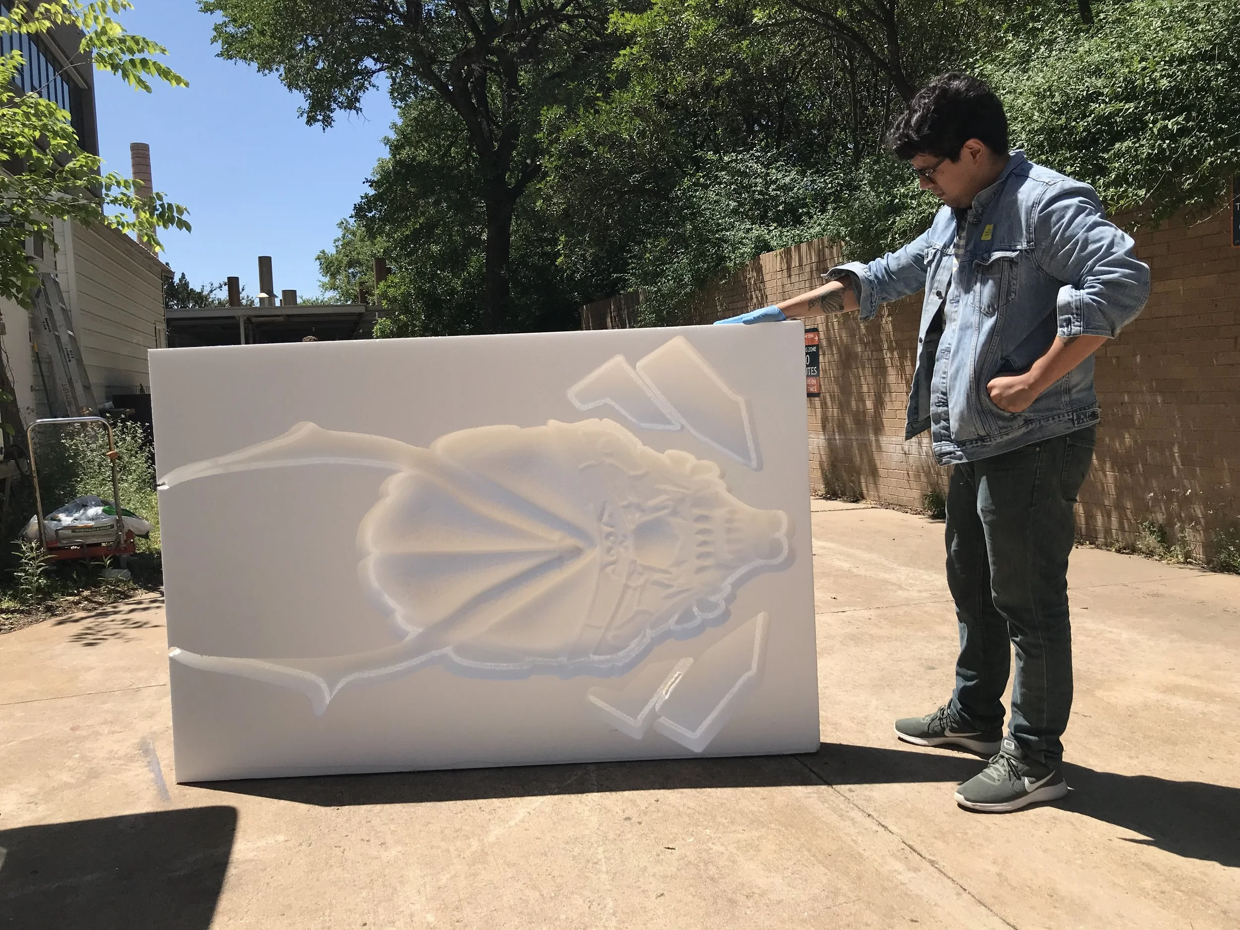 Miguel at The University of Texas at Austin with his finished piece made of styrofoam