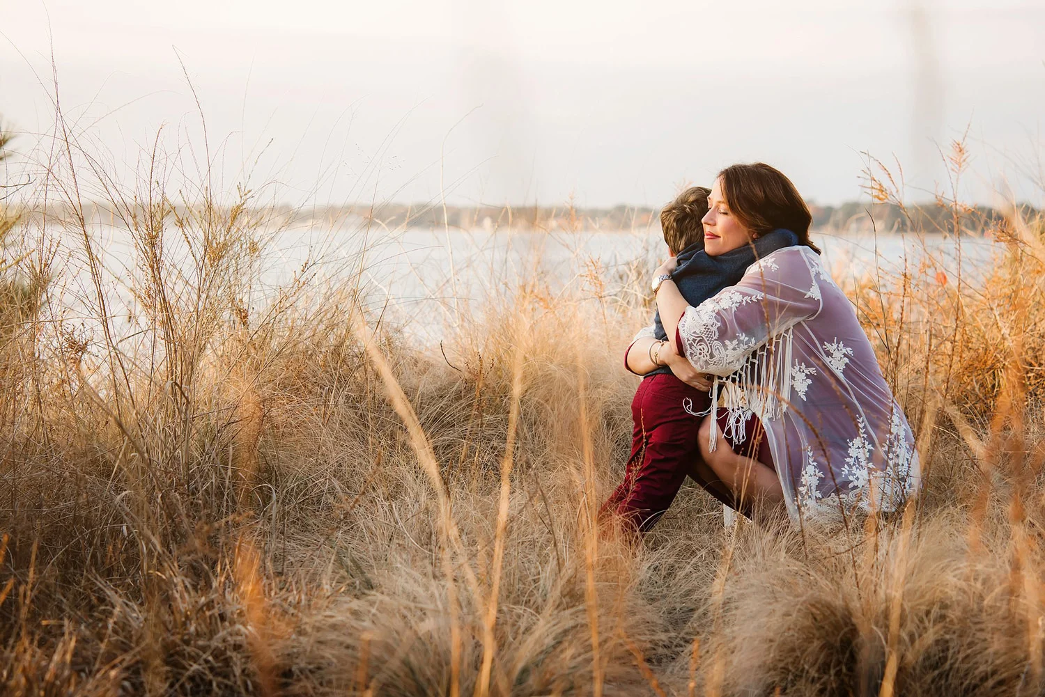 mom-and-little-boy-embrace-by-the-shore-virginia-beach-mom-and-me-sessions-by-melissa-bliss-photography.jpg