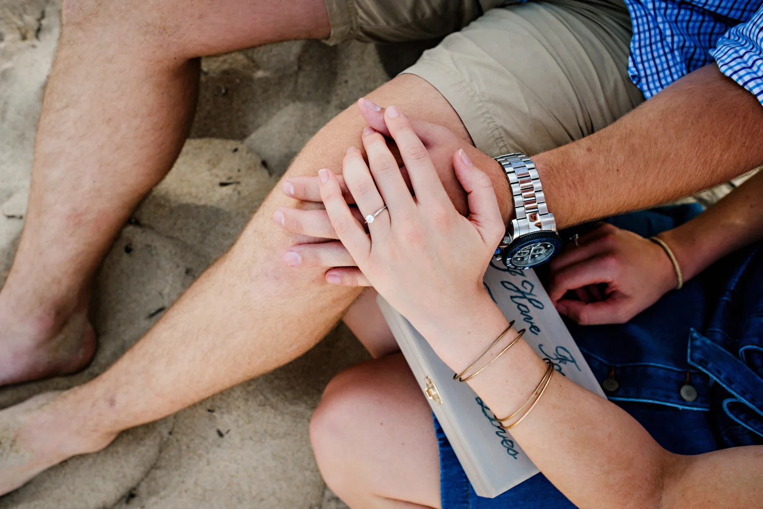 surprise-beach-proposal-engaged-couple-on-the-beach-melissa-bliss-photography-va-beach-va.jpg