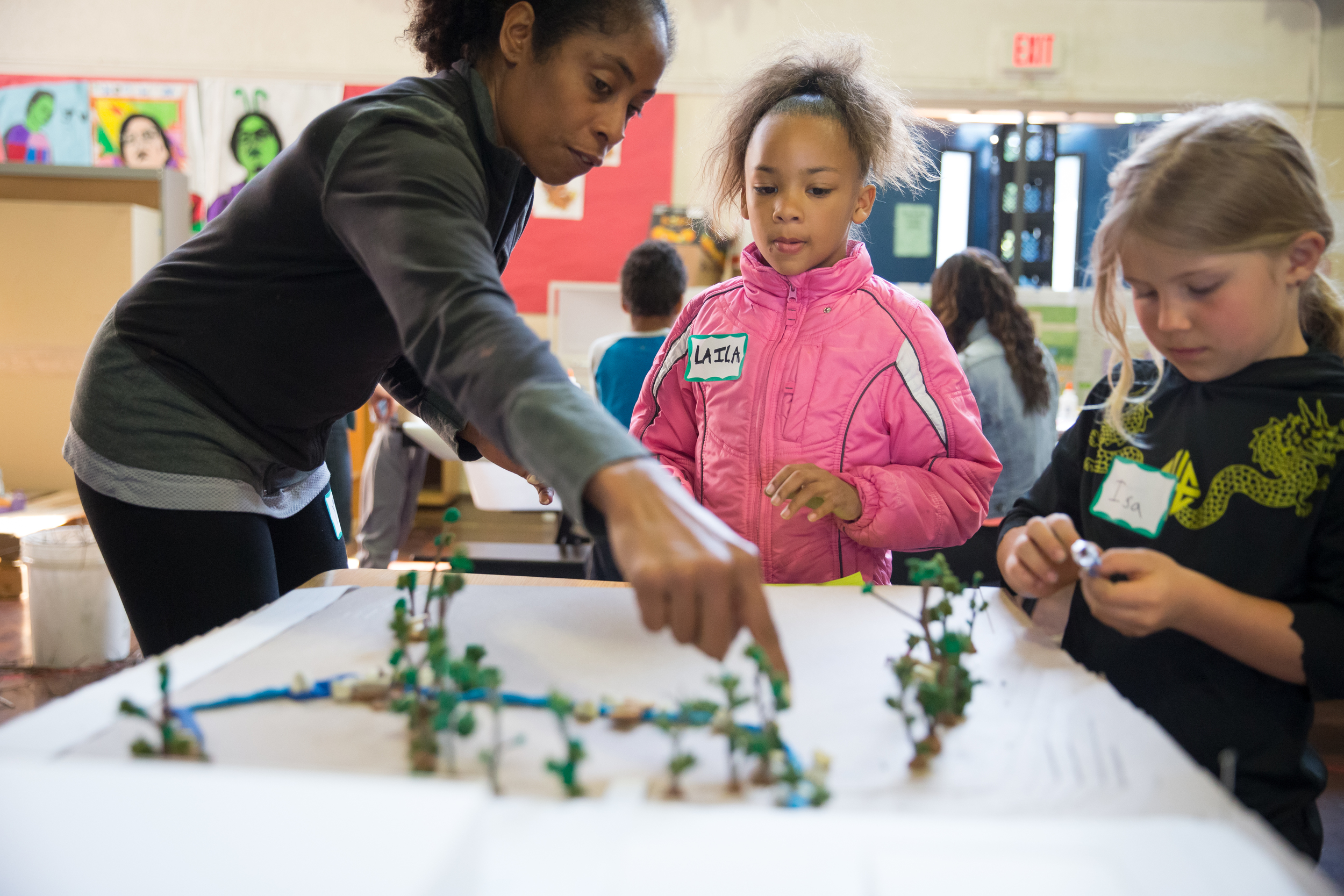 DESIGN DAY AT MELROSE LEADERSHIP ACADEMY May 9, 2016 - Miller Company collaborated with the Trust For Public Land in hosting a Design Day workshop at Melrose Leadership Academy . Maya, who is our lead designer on the upcoming project for the new playground, showed the community Miller Company's recent renderings, answering questions and getting feedback from the parents, teachers and children. Meanwhile, the kids built miniature models of play areas with clay and leaves! :) See more pics on our site under 'Schools.'