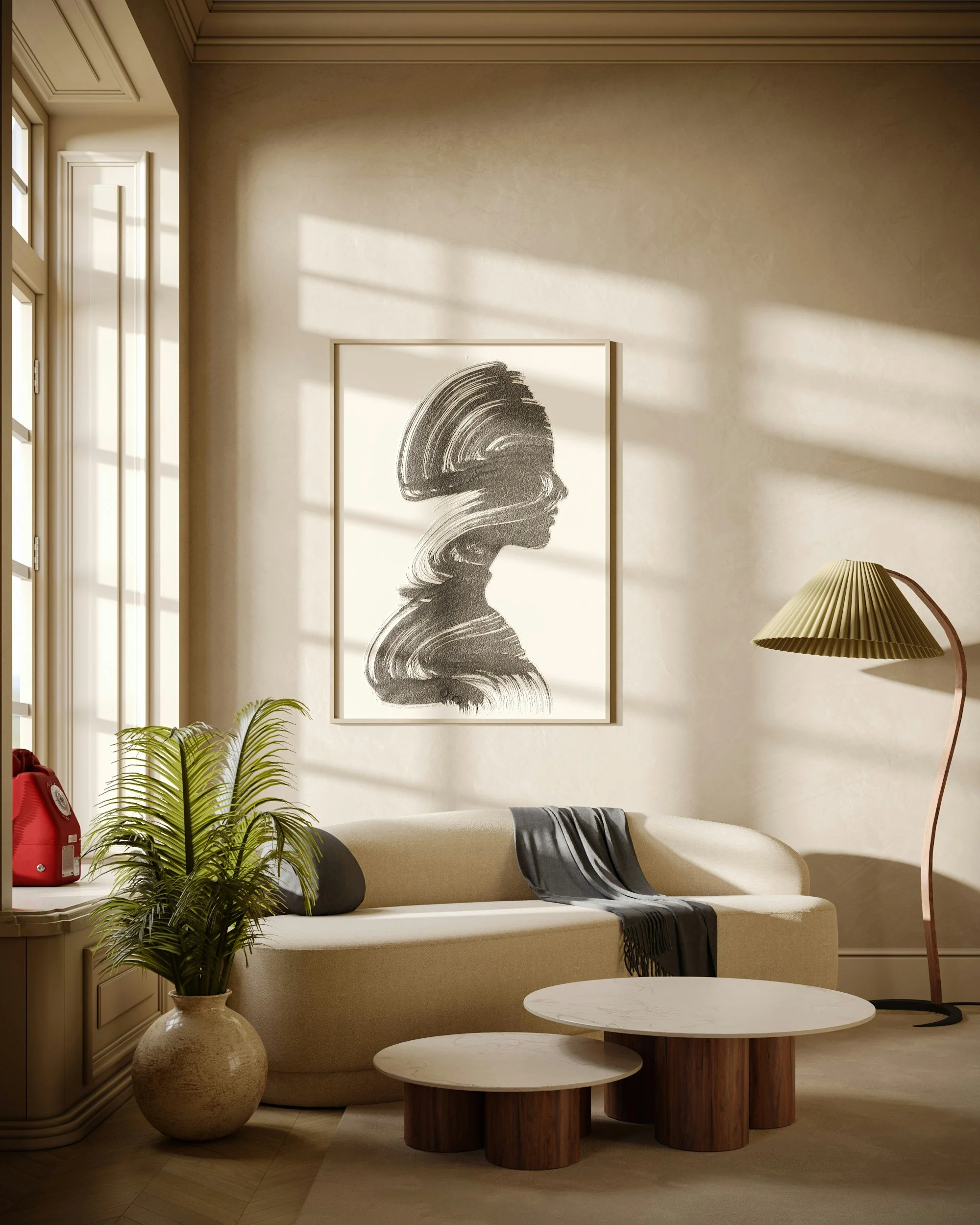 Interior of a modern, well-lit living room with a beige sofa, decorative pillows, layered coffee tables with white marble tops and wooden bases, a large framed abstract black and white artwork, a tall beige floor lamp with a textured lampshade, a large potted plant with green leaves, a red fire extinguisher, and sunlight streaming through a window.