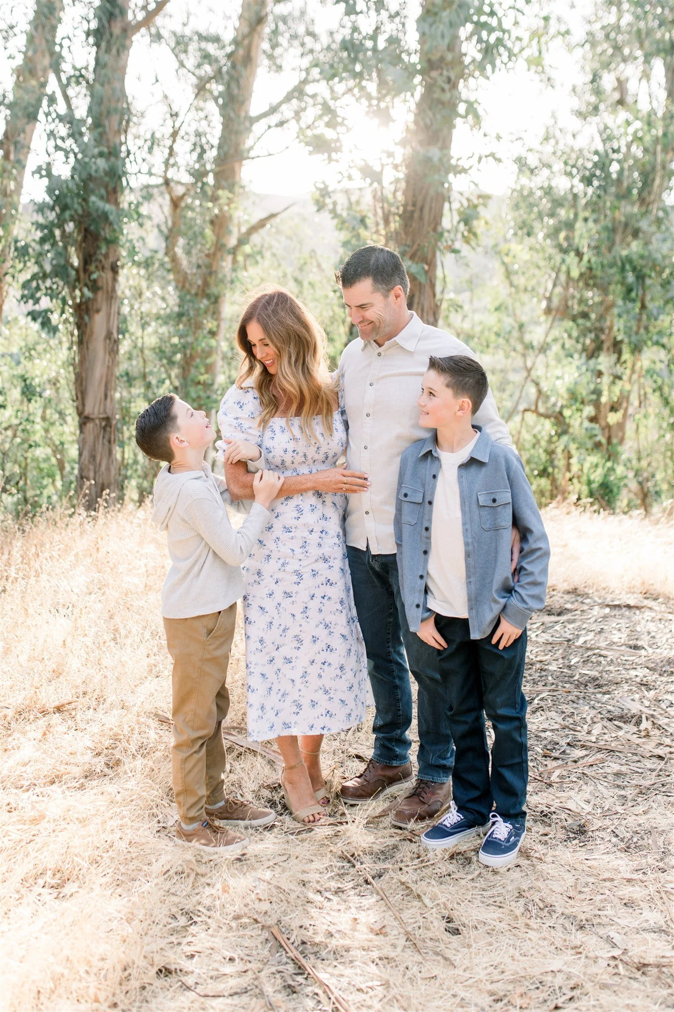 Family of four takes photos in Lafayette eucalyptus grove