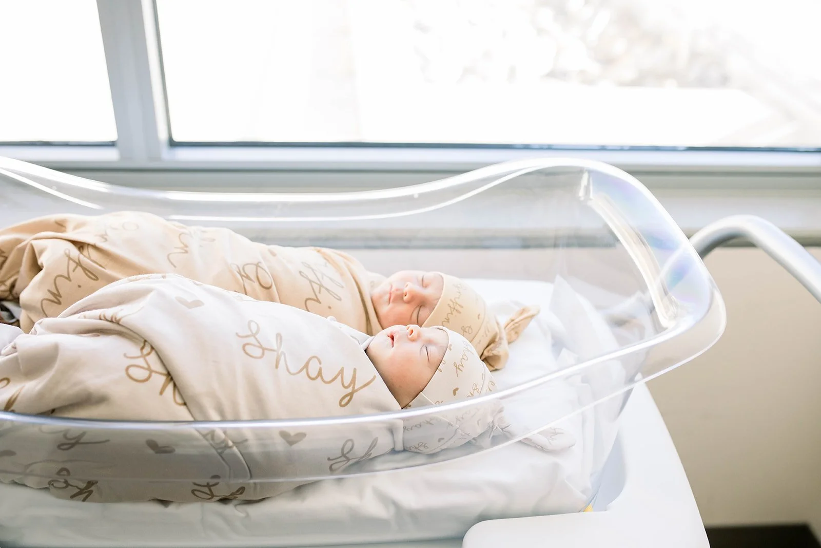 Twin baby boys profile in bassinet at John Muir Hospital