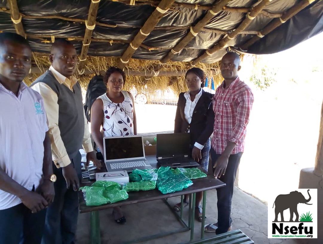 Teachers and NWCF Board Members receiving Laptops and Tablets!