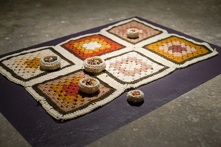 Nest #2, 2010-2011 / Altered costume jewelry in nests crocheted from deconstructed, found afghans