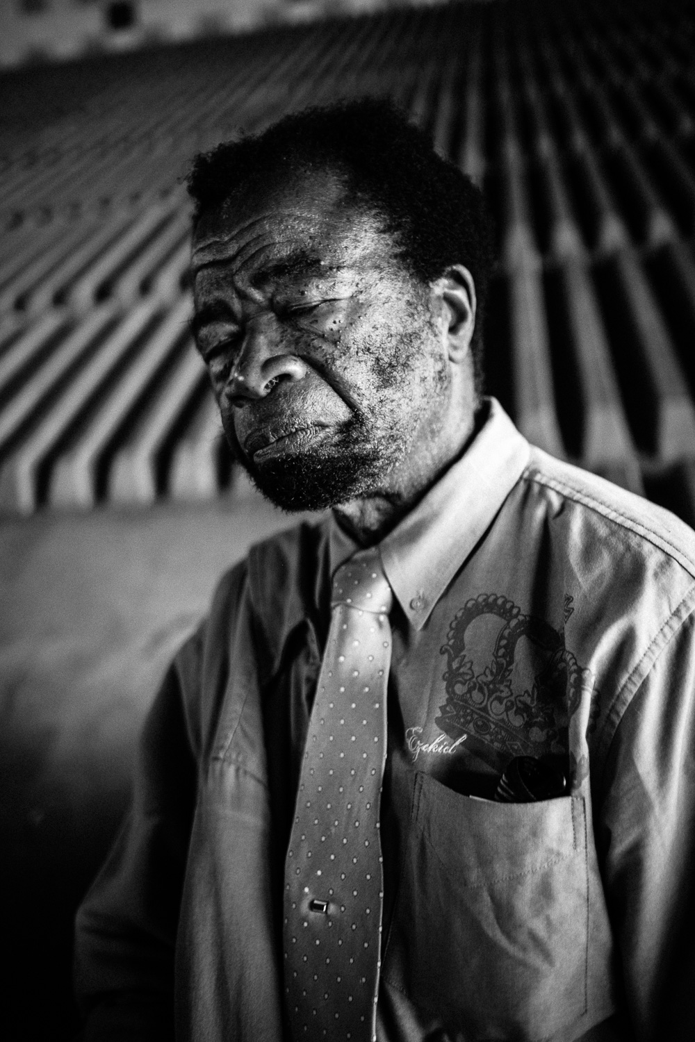 Moment Six: After so many moments a man is bound to get tired. You've been there I'm sure. Who can't but doze off when you get exhausted talking with strangers? I fault him in no way. Perhaps more than any other image this one carries with it the feeling that he may be homeless...who else sleeps in public? But none of this is really the case. The ambiguity of a moment comes from, in part, the fact that the surrounding moments are unknown. Johnny, like us, blinks. My camera saw fit to go "click" right then.