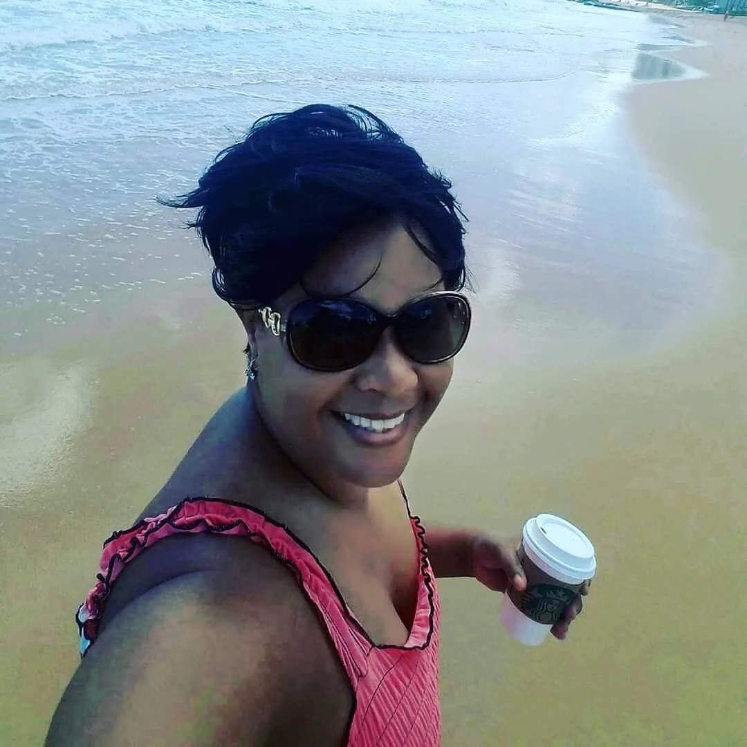 on the beach with a coffee cup.jpg