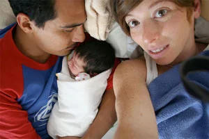 During the five and a half hours I labored at home with my first child, Lauren was wonderful. She was comforting, patient, and extremely helpful. She guided me through the waves, step by step, moment by moment. She helped me to stop clenching my fists and resisting the pain; she reminded me that I needed to let go of my upper body, let the waves go down, and allow my body to open. She made me feel safe and strong. She reminded me to moan low, not in a high-pitched tone. She recommended different positions, (I preferred to be on all fours.) She suggested I go to the bathroom because an empty bladder would make more room for baby to move down and she was right! After following her instructions, baby’s head began to crown. Not 15 minutes later, after pushing three times, my son was born. Lauren helped me to get him to successfully latch, and she and Cristina sewed up a small tear that I incurred, because baby came out with his hand on his cheek. Lauren was a true asset to me on that day. I am so glad she was there by my side. Beth B.