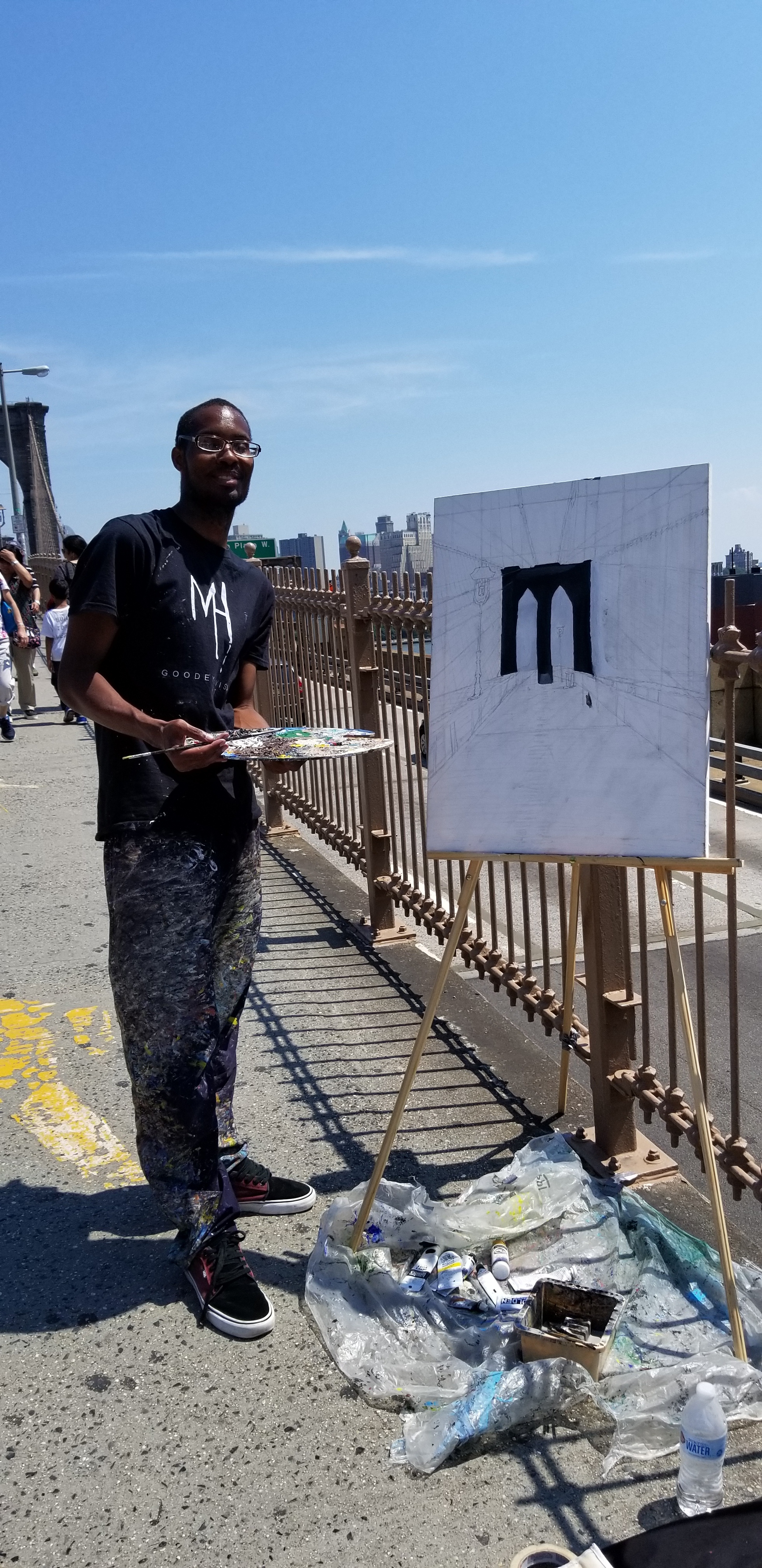 Me painting The Brooklyn Bridge Walkway on the bridge with my display artwork,