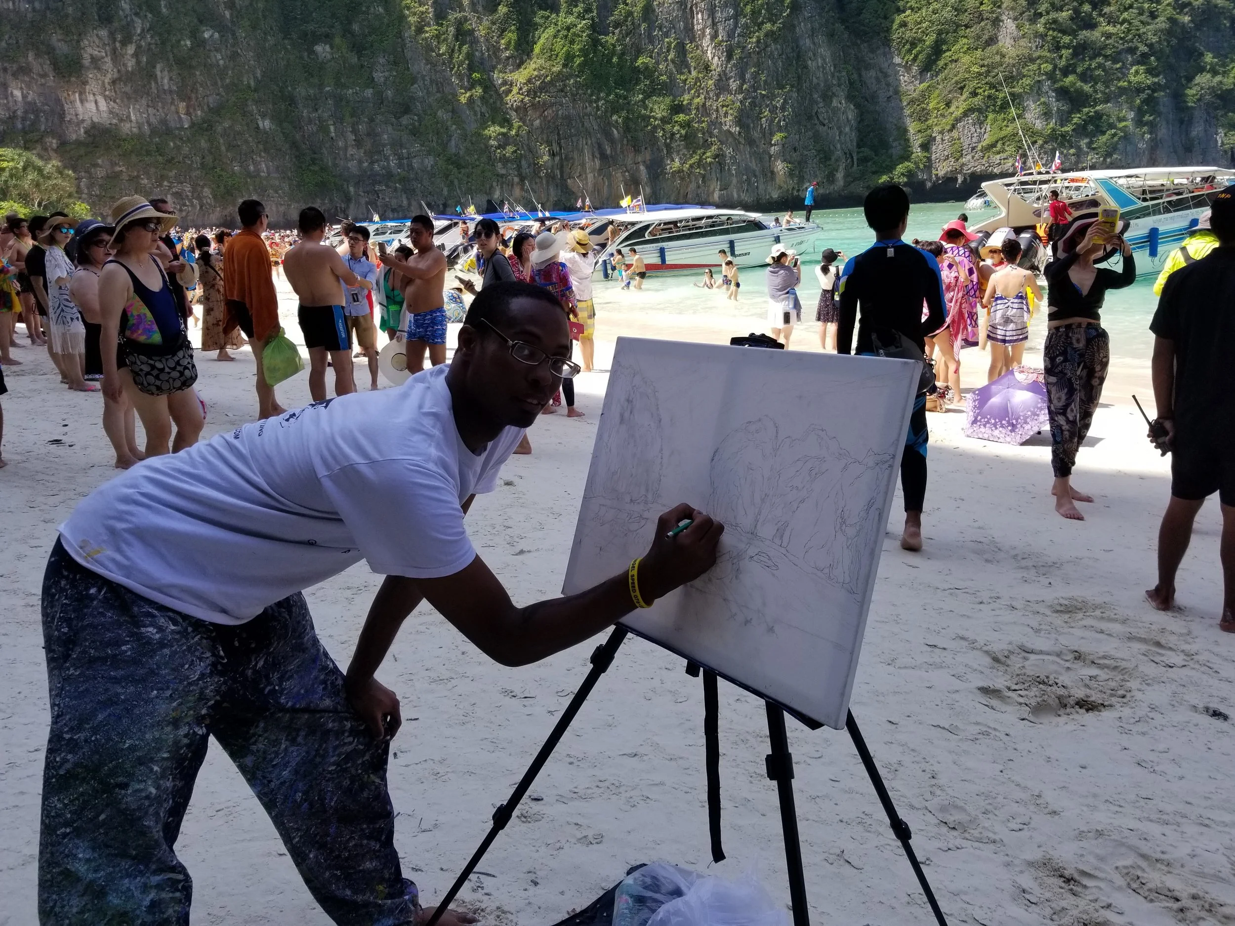Me sketching out my painting of the Maya Beach Phi Phi Island on a canvas. 