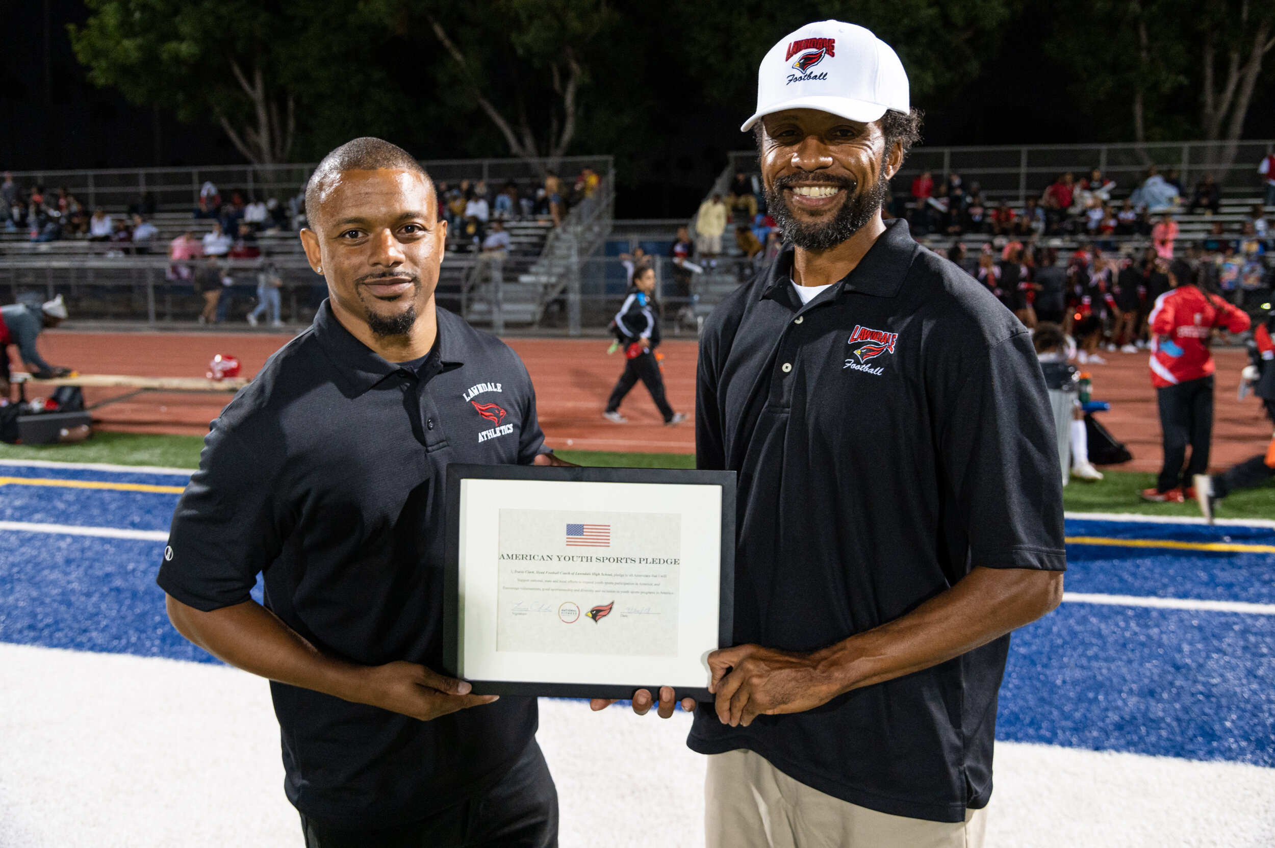  Travis Clark, Head Football Coach, Lawndale High School takes the American Youth Sports Pledge. 
