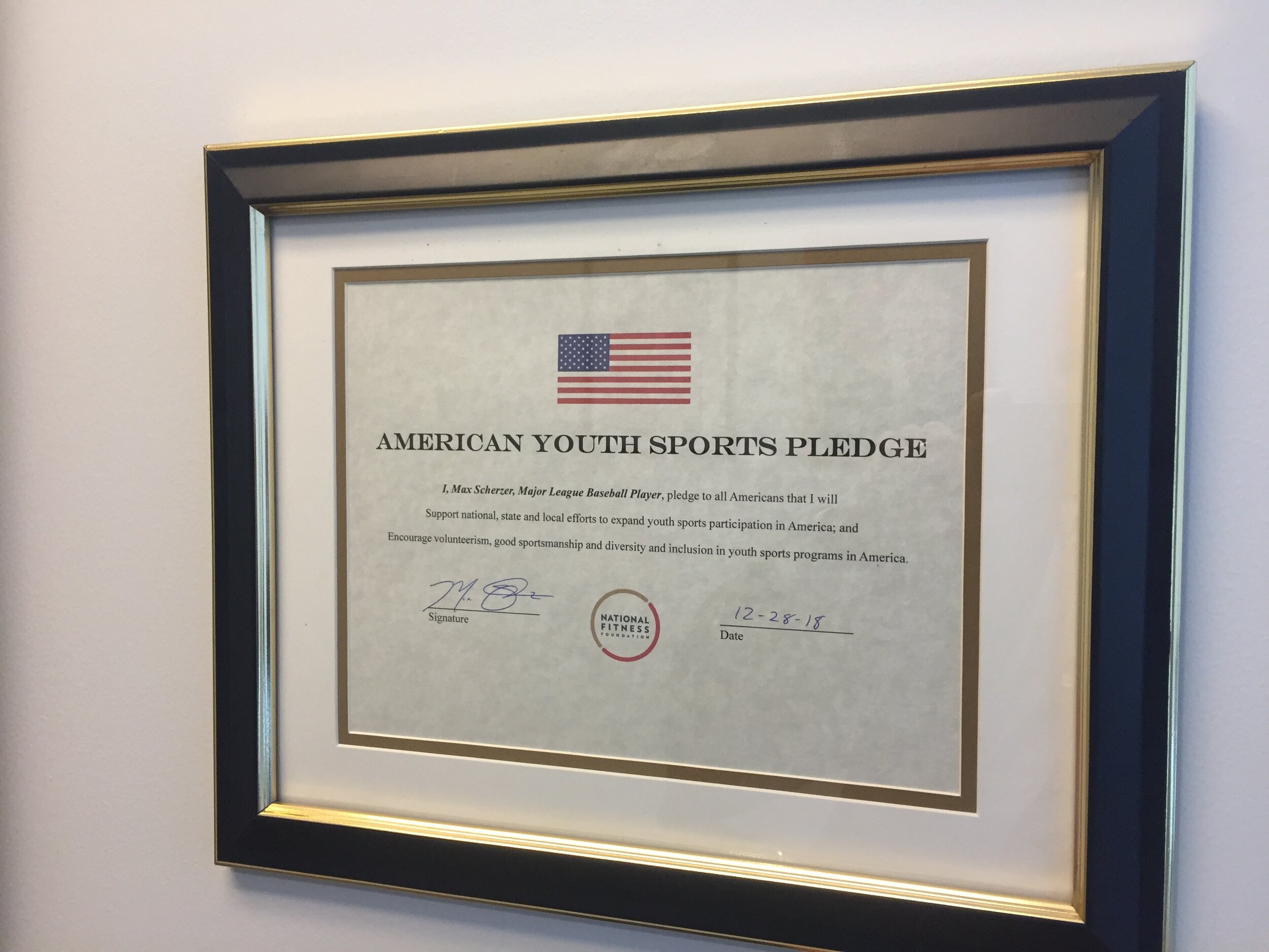  Washington Nationals starting pitcher, Max Scherzer’s American Youth Sports Pledge hangs in the National Fitness Foundation Office. 