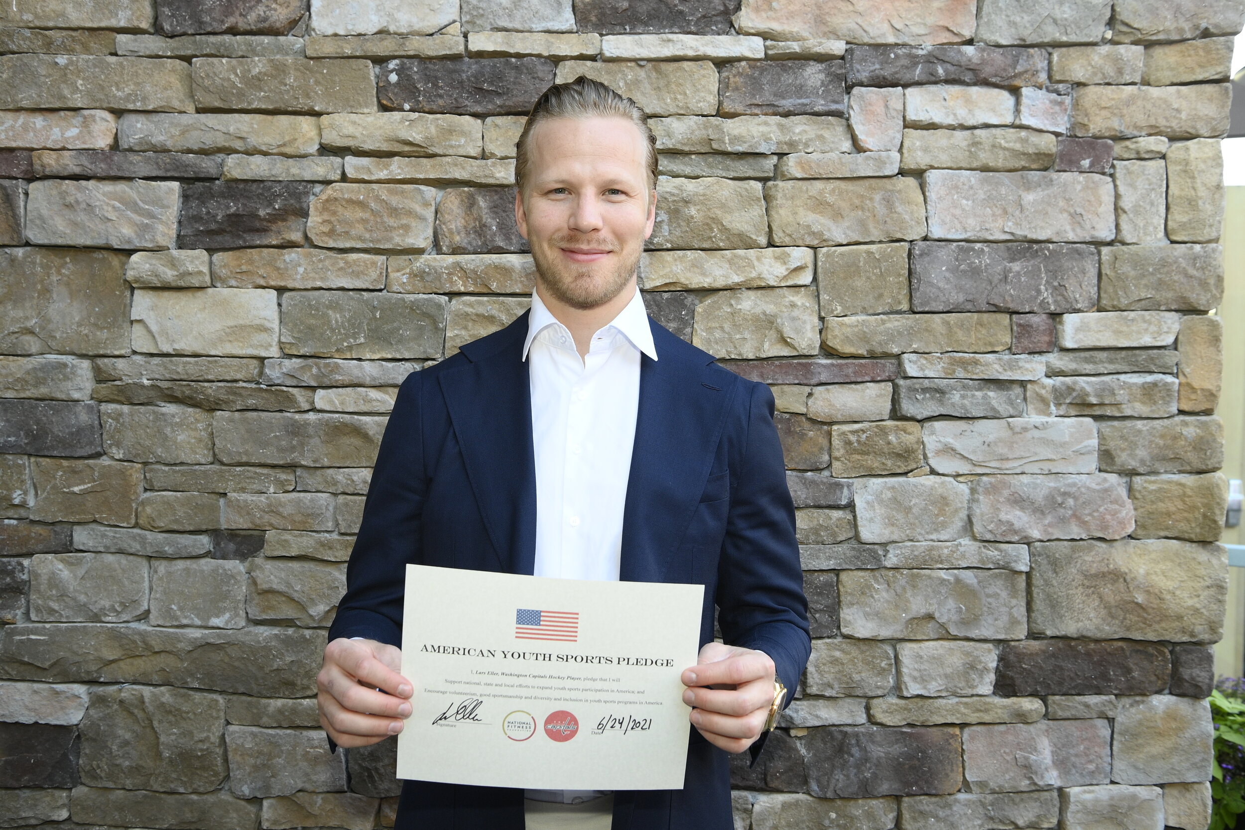  Lars Eller of the Washington Capitals takes the American Youth Sports Pledge. 