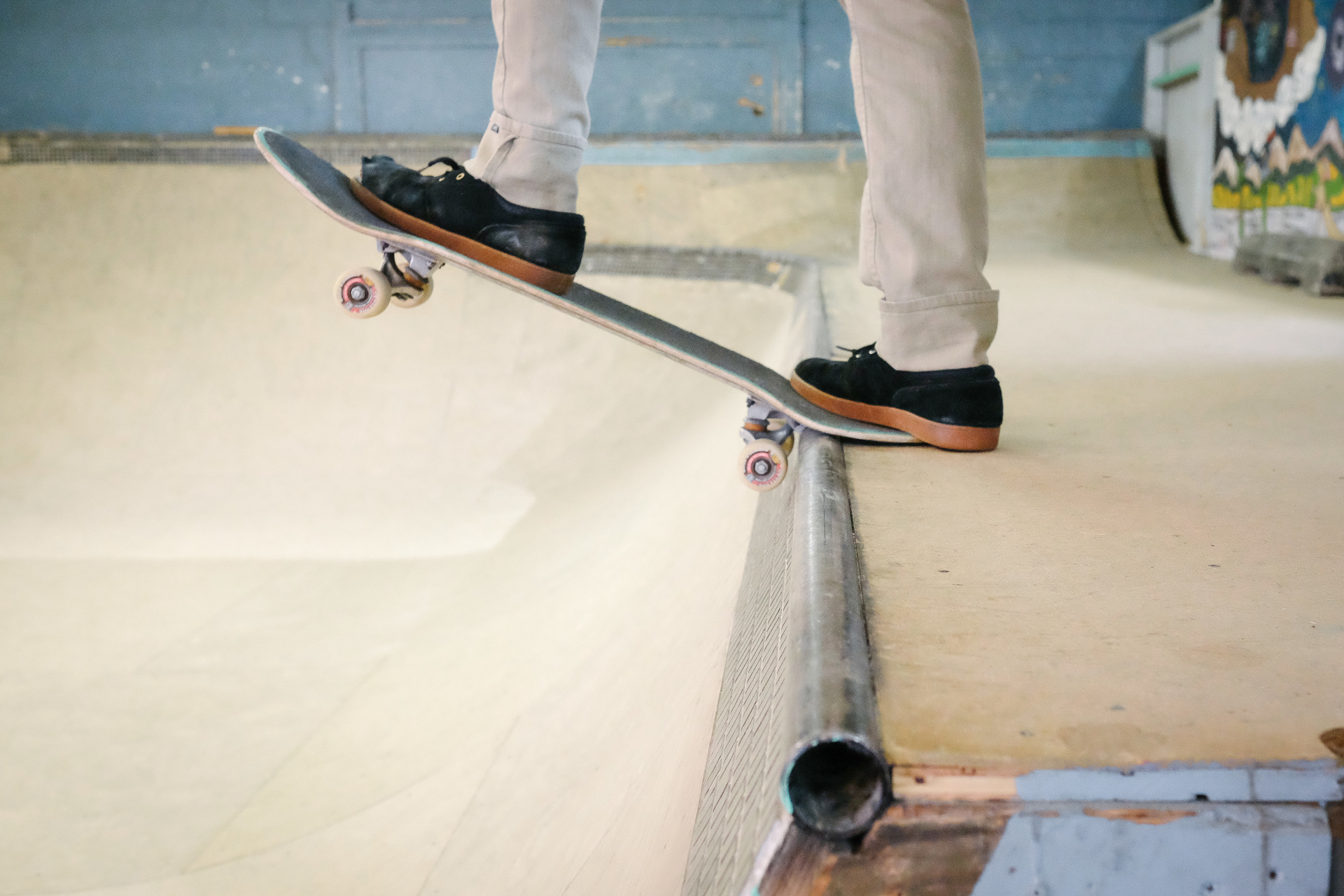A skater prepares to drop in the bowl at Launch's indoor facility.