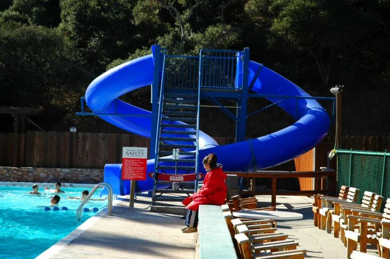 Red Cross Certified Lifeguards monitor the slides