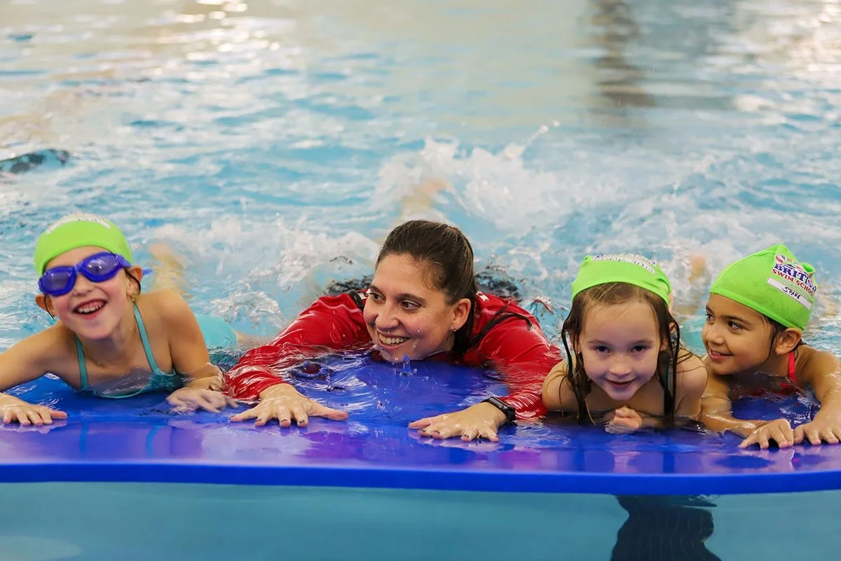 Director of Aquatics Melissa teaching children how to swim