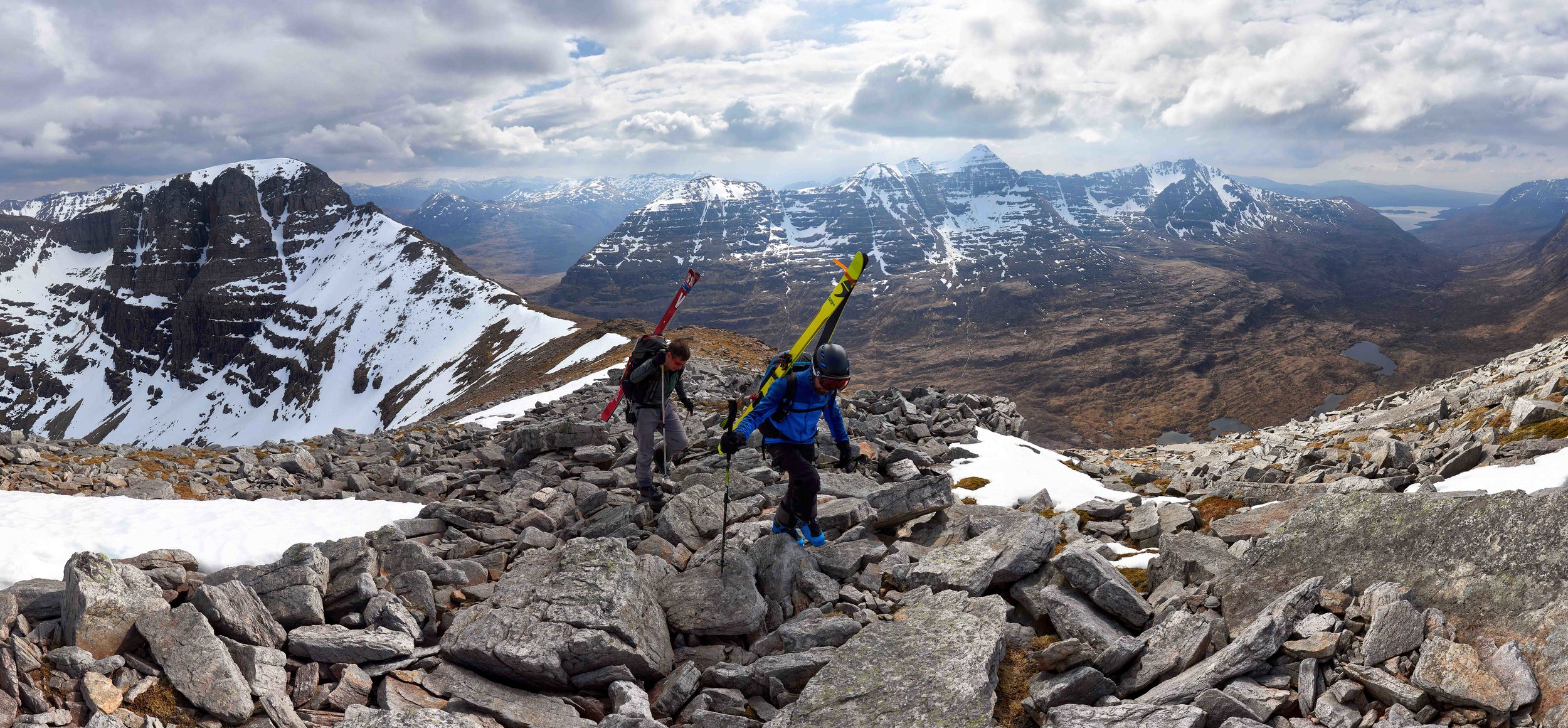 Hiking towards Sail Mhor and Morrisons Gully, with views of Beinn Eighe's Triple Buttress, Fuselage Gully (the complete line running down the lookers right side of the buttress) and Liathach stretched out behind.